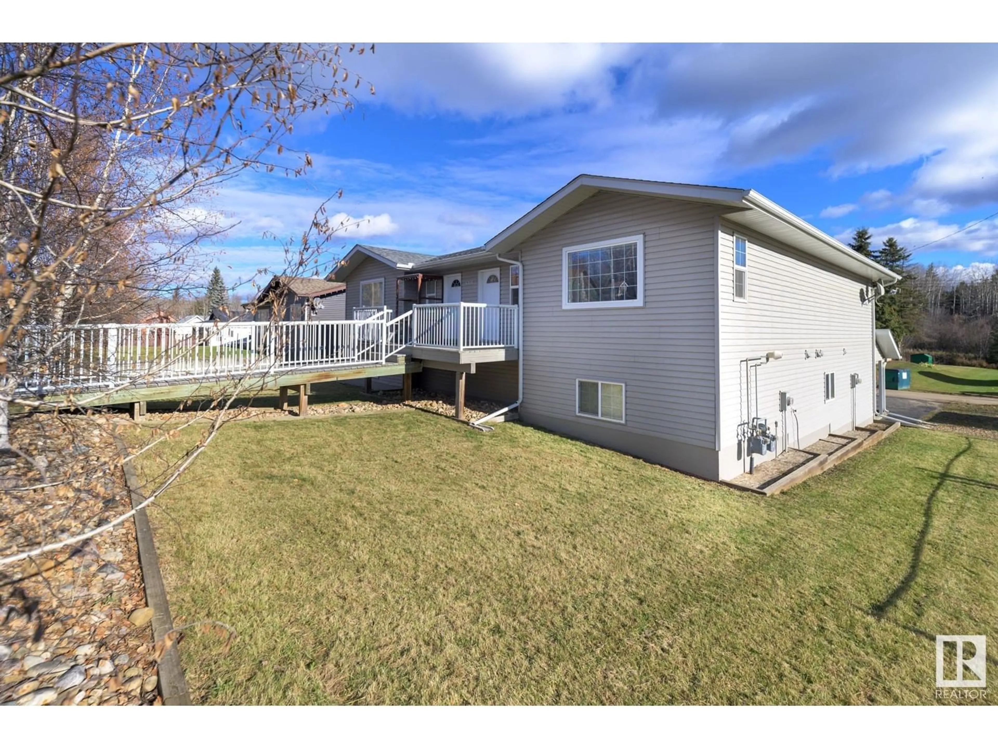 Frontside or backside of a home, the fenced backyard for 4910 58 ST, Athabasca Town Alberta T9S1L5