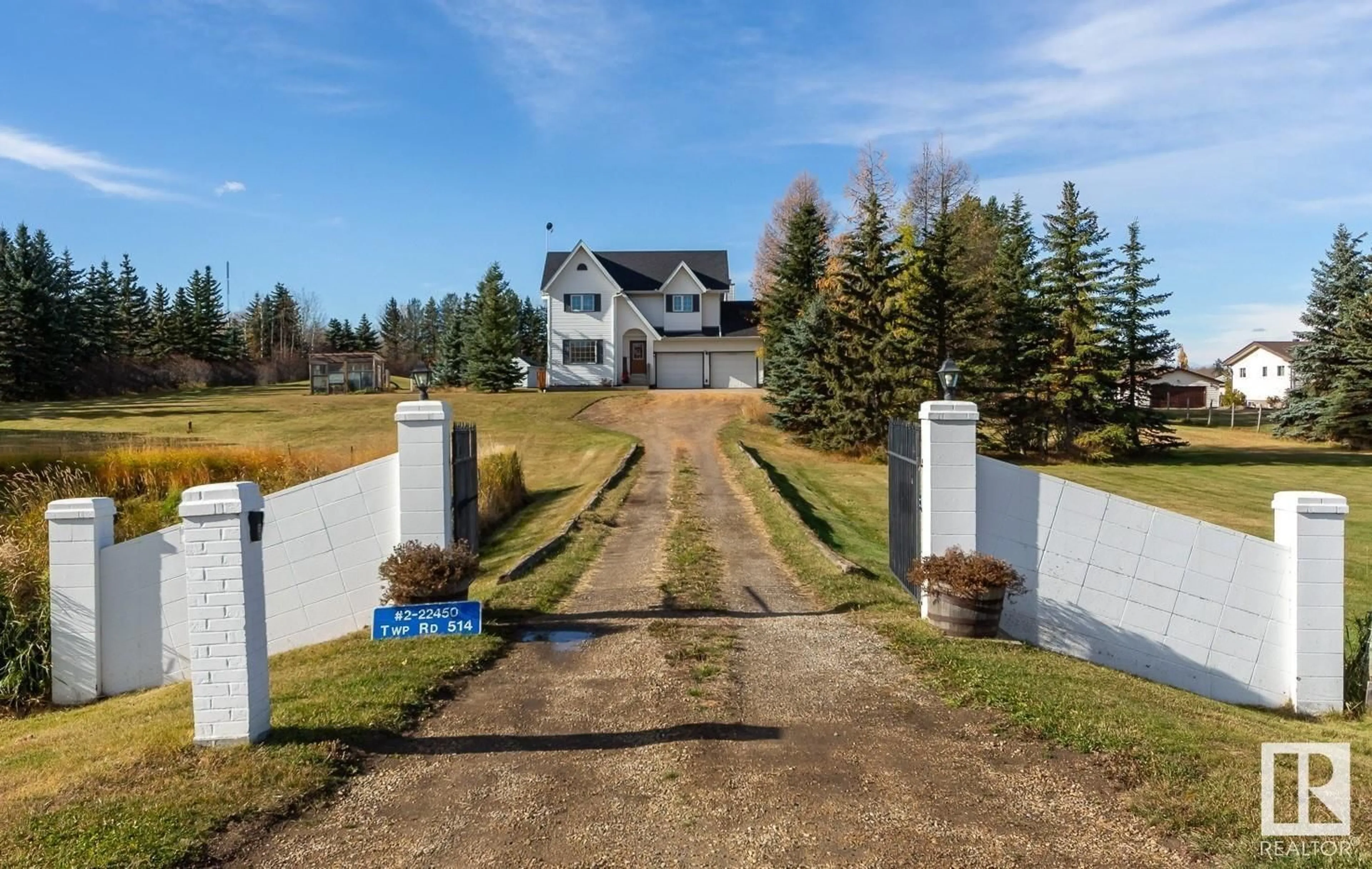 Frontside or backside of a home, the fenced backyard for #2 22450 TWP ROAD 514, Rural Strathcona County Alberta T8C1H5