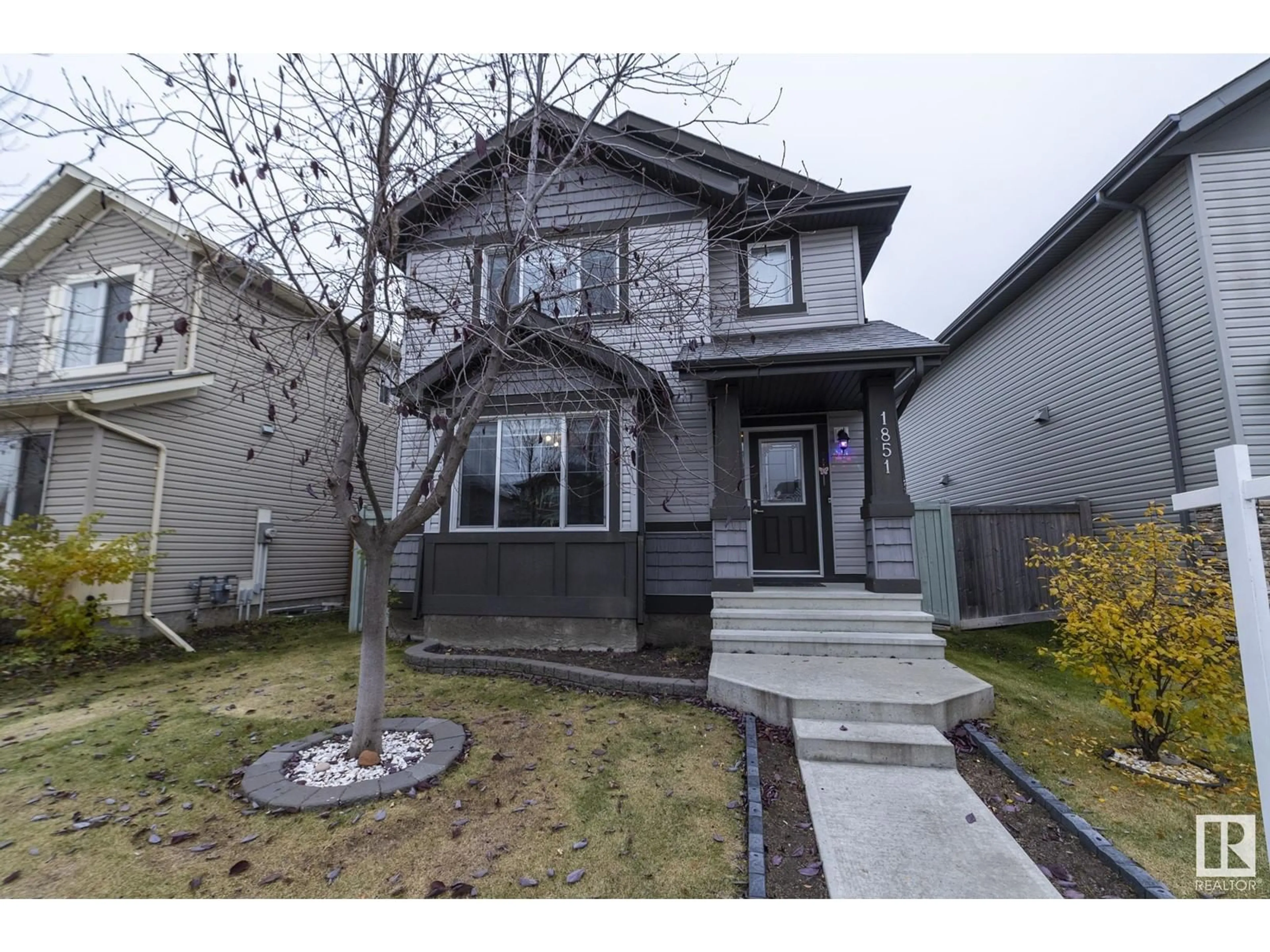 Frontside or backside of a home, the street view for 1851 32 ST NW, Edmonton Alberta T6T0N7