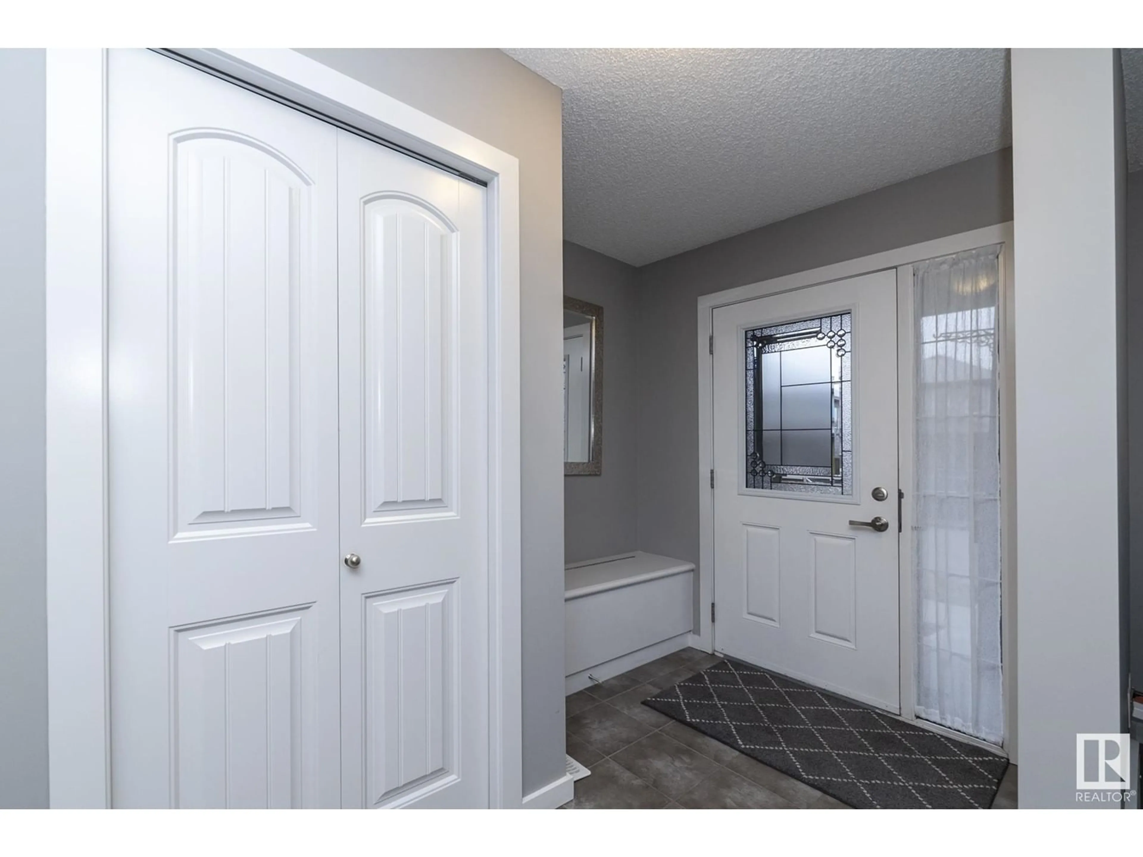 Indoor entryway, wood floors for 1851 32 ST NW, Edmonton Alberta T6T0N7