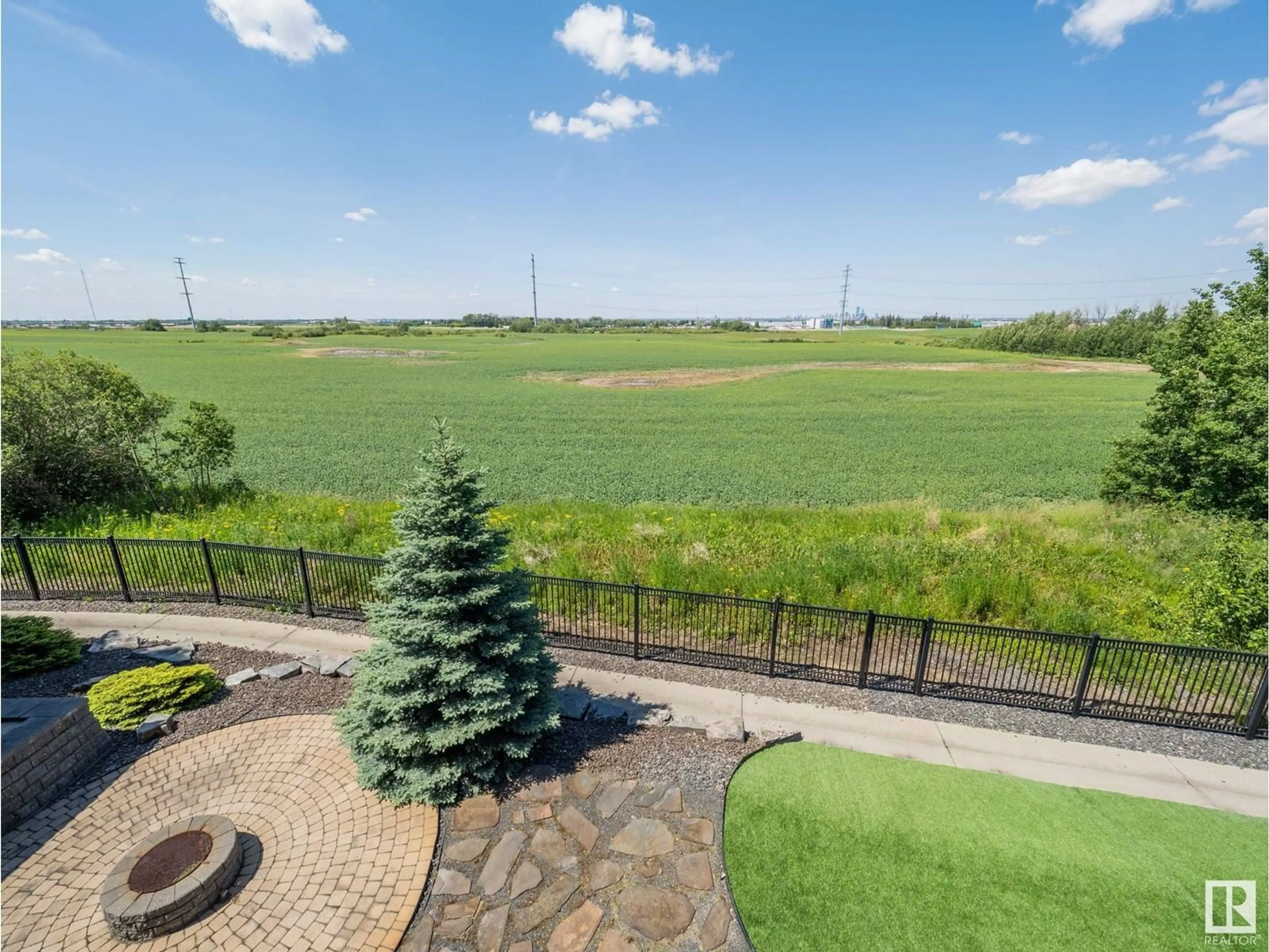 Patio, the fenced backyard for #471 52328 RGE ROAD 233, Rural Strathcona County Alberta T8B0A2