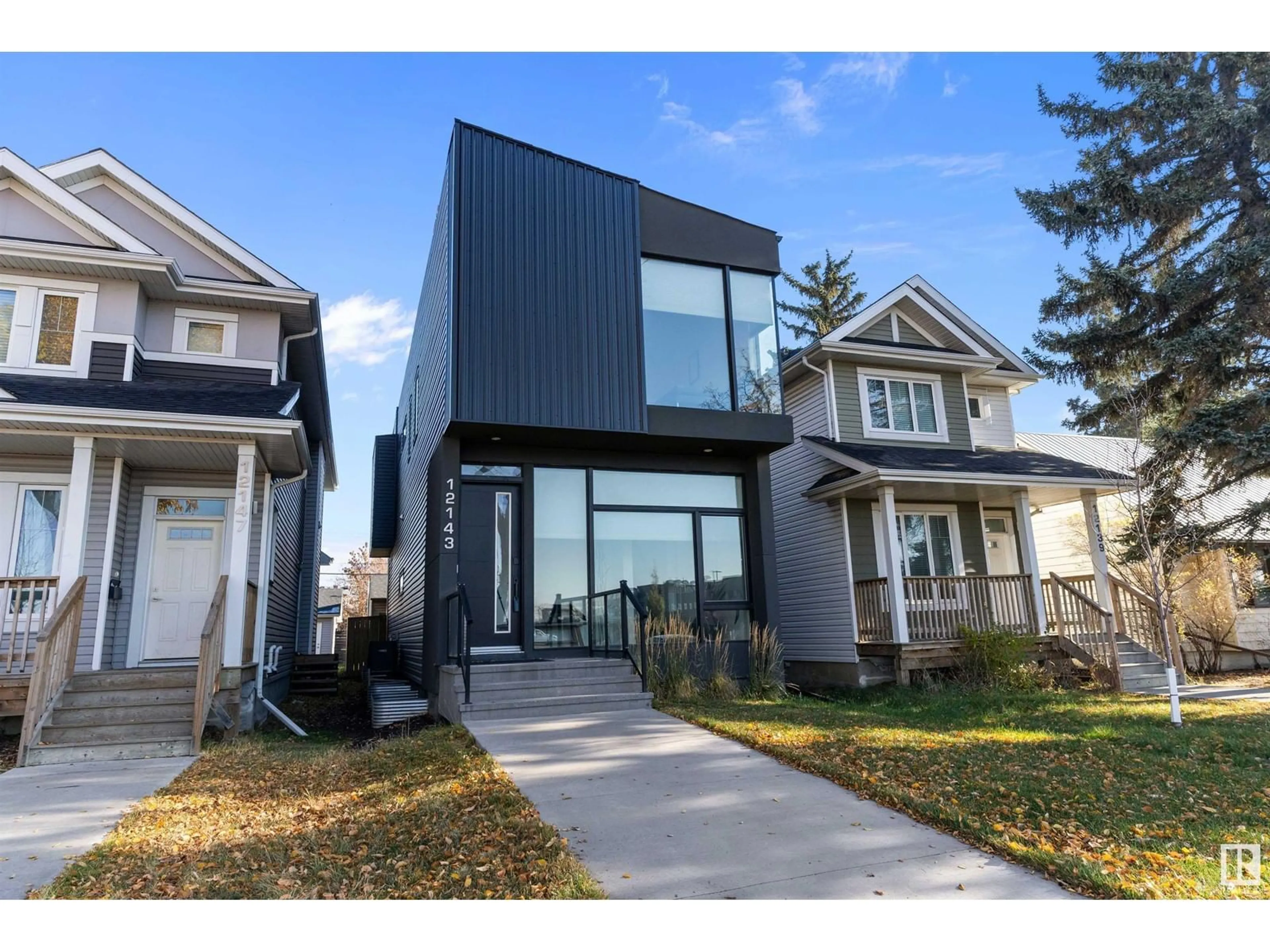 Frontside or backside of a home, the fenced backyard for 12143 107 ST NW, Edmonton Alberta T5G2S8