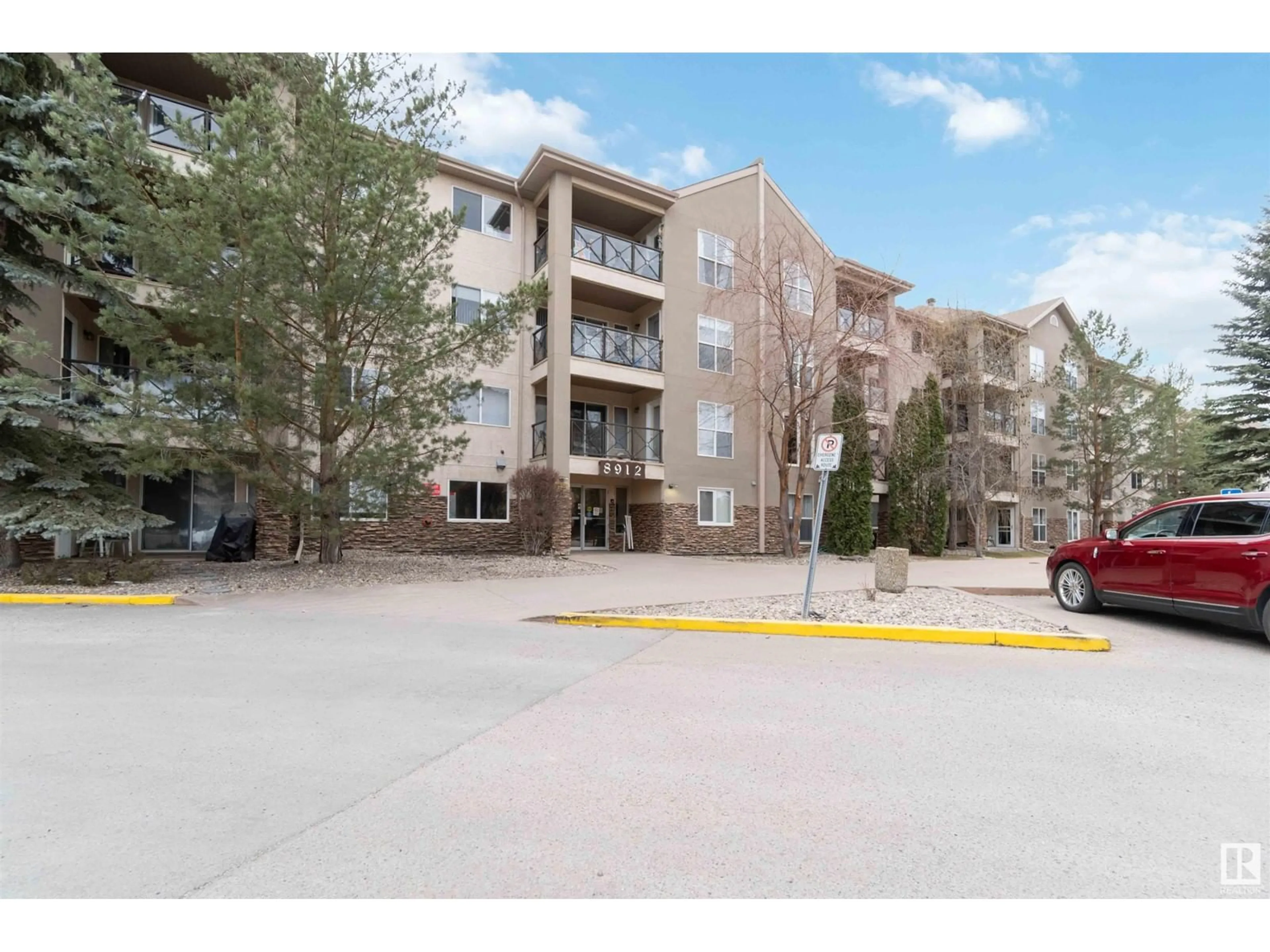 A pic from exterior of the house or condo, the street view for #410 8912 156 ST NW, Edmonton Alberta T5R1Y6