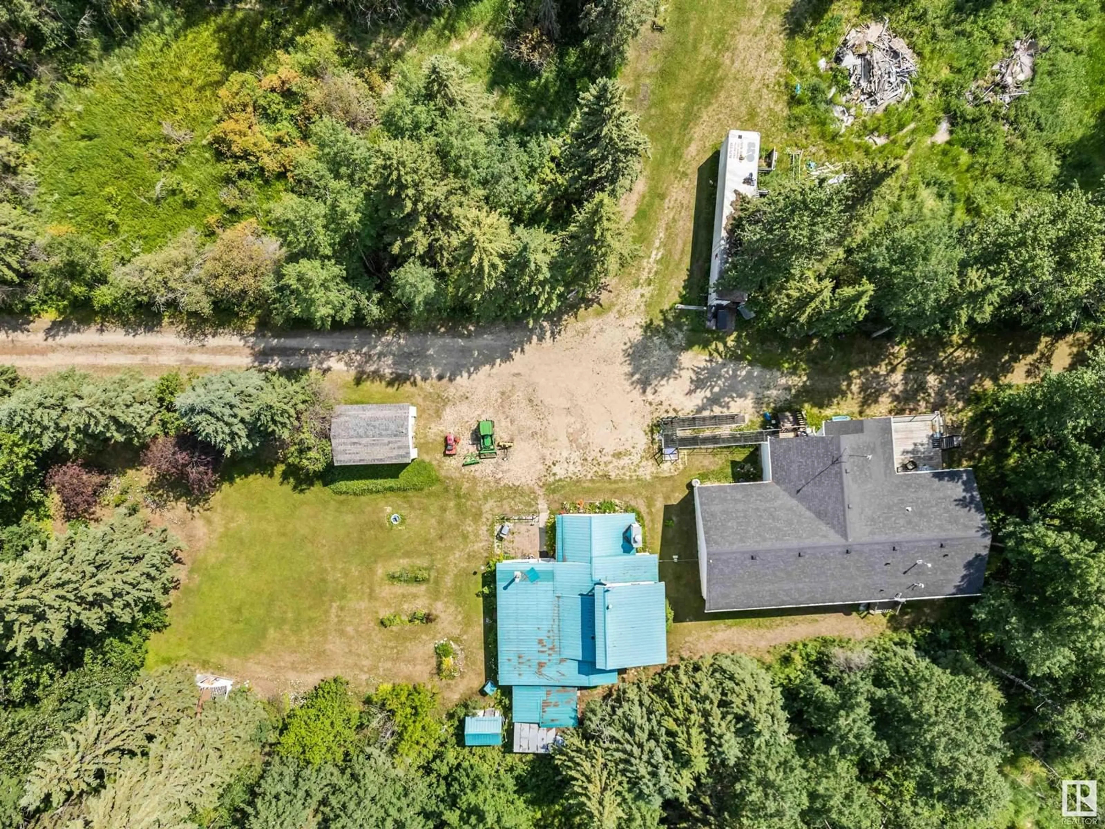 Frontside or backside of a home, the fenced backyard for 53302 RRD 65, Rural Parkland County Alberta T0E0S0