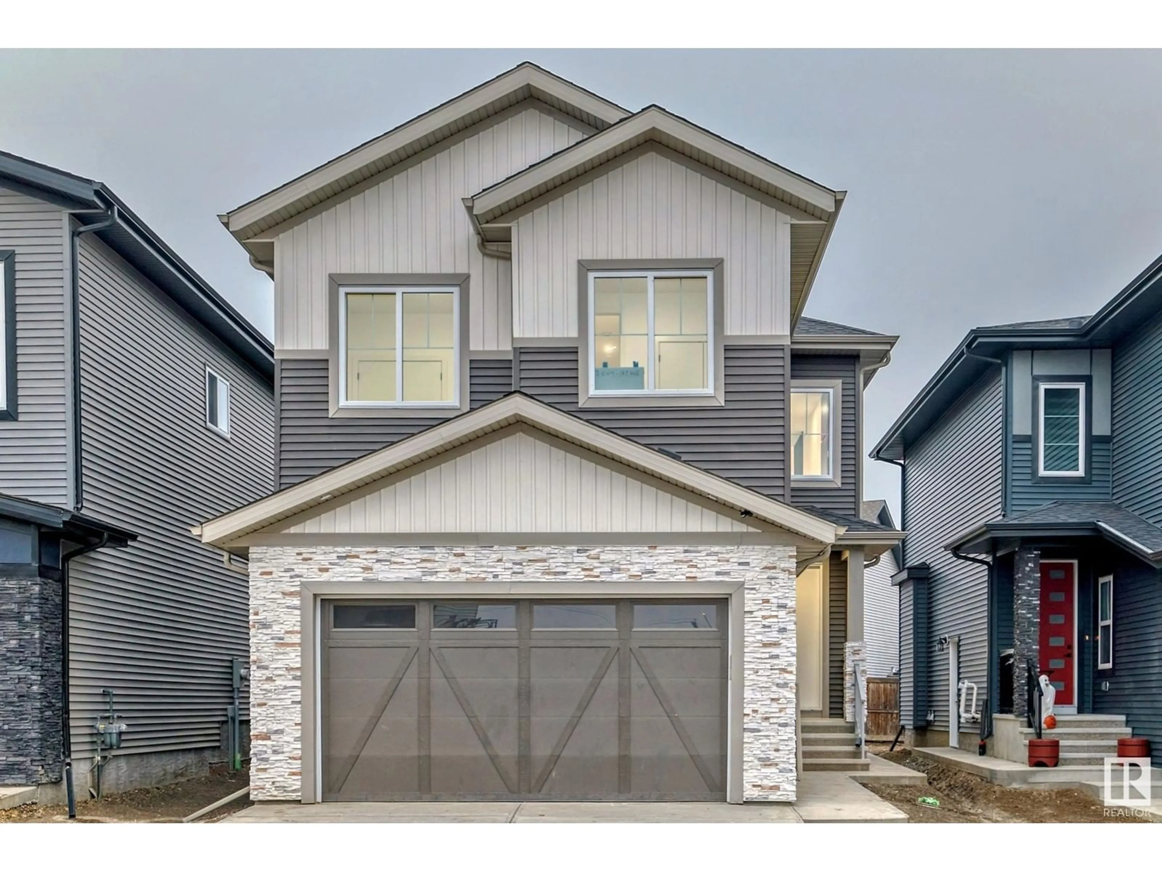 Frontside or backside of a home, the street view for 7004 169 AV NW, Edmonton Alberta T5Z0B5