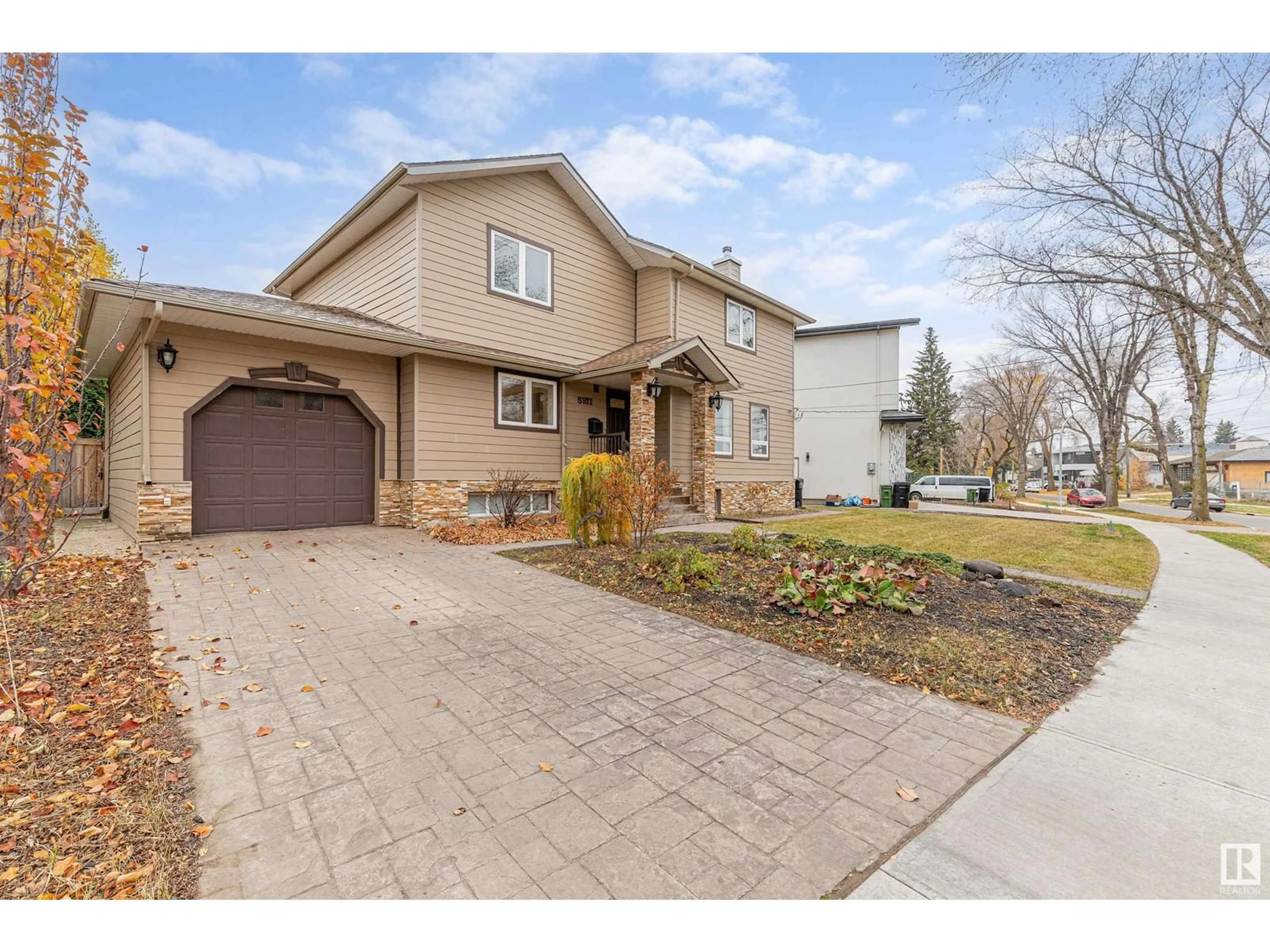 Frontside or backside of a home, the street view for 5911 110 ST NW, Edmonton Alberta T6H3E4