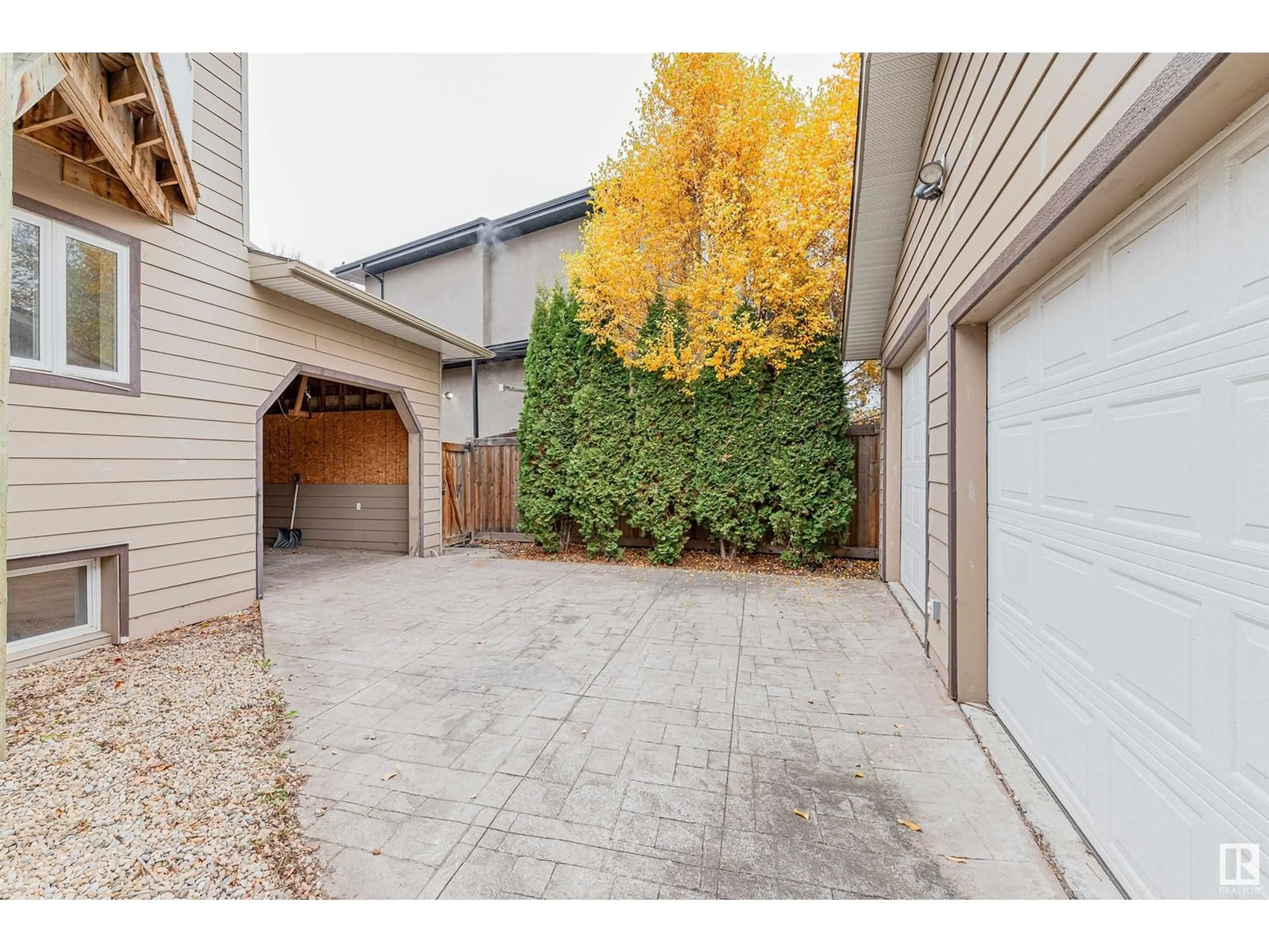 Frontside or backside of a home, the fenced backyard for 5911 110 ST NW, Edmonton Alberta T6H3E4