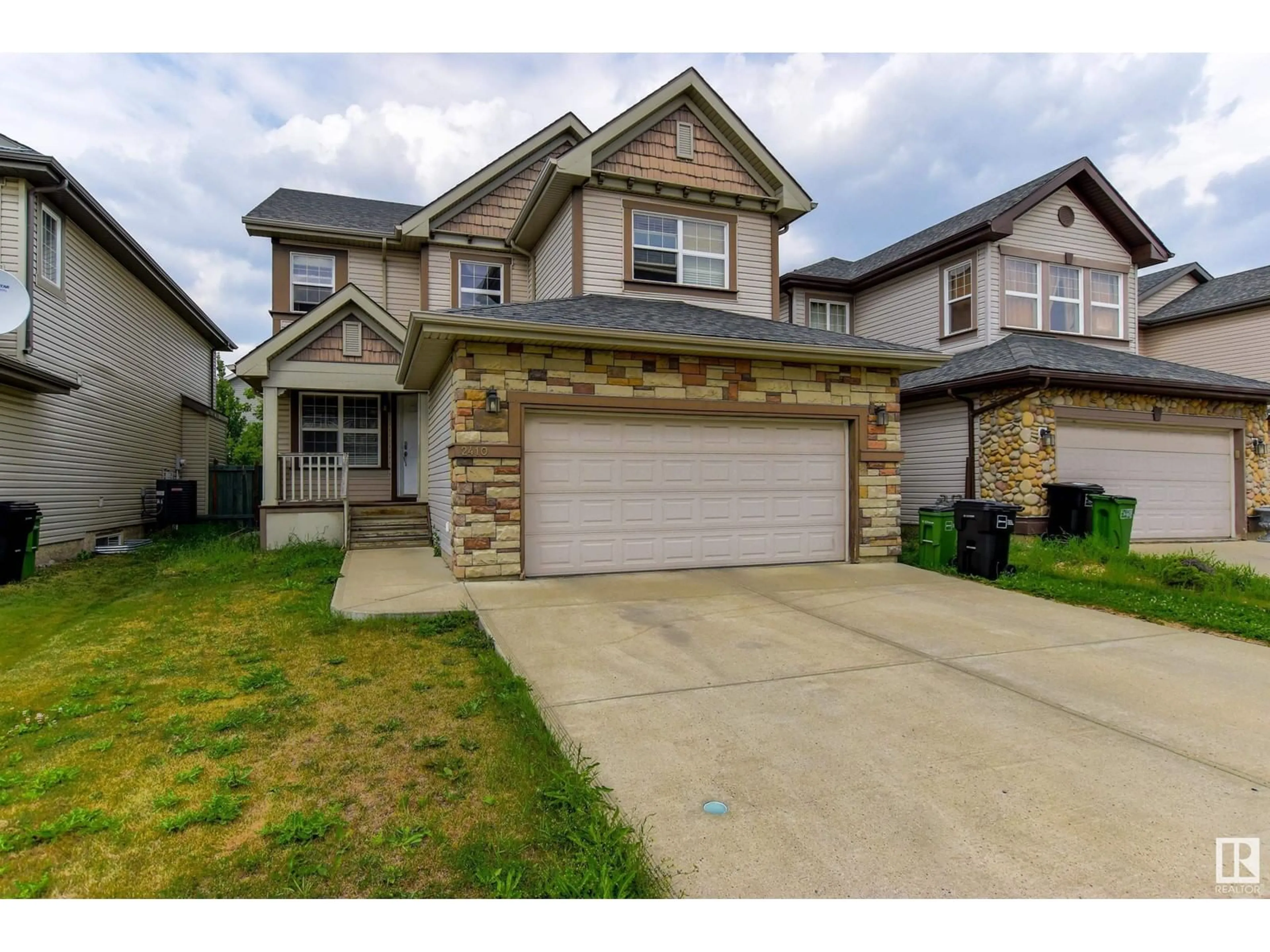 Frontside or backside of a home, the street view for 2410 HAGEN WY NW, Edmonton Alberta T6R3M6