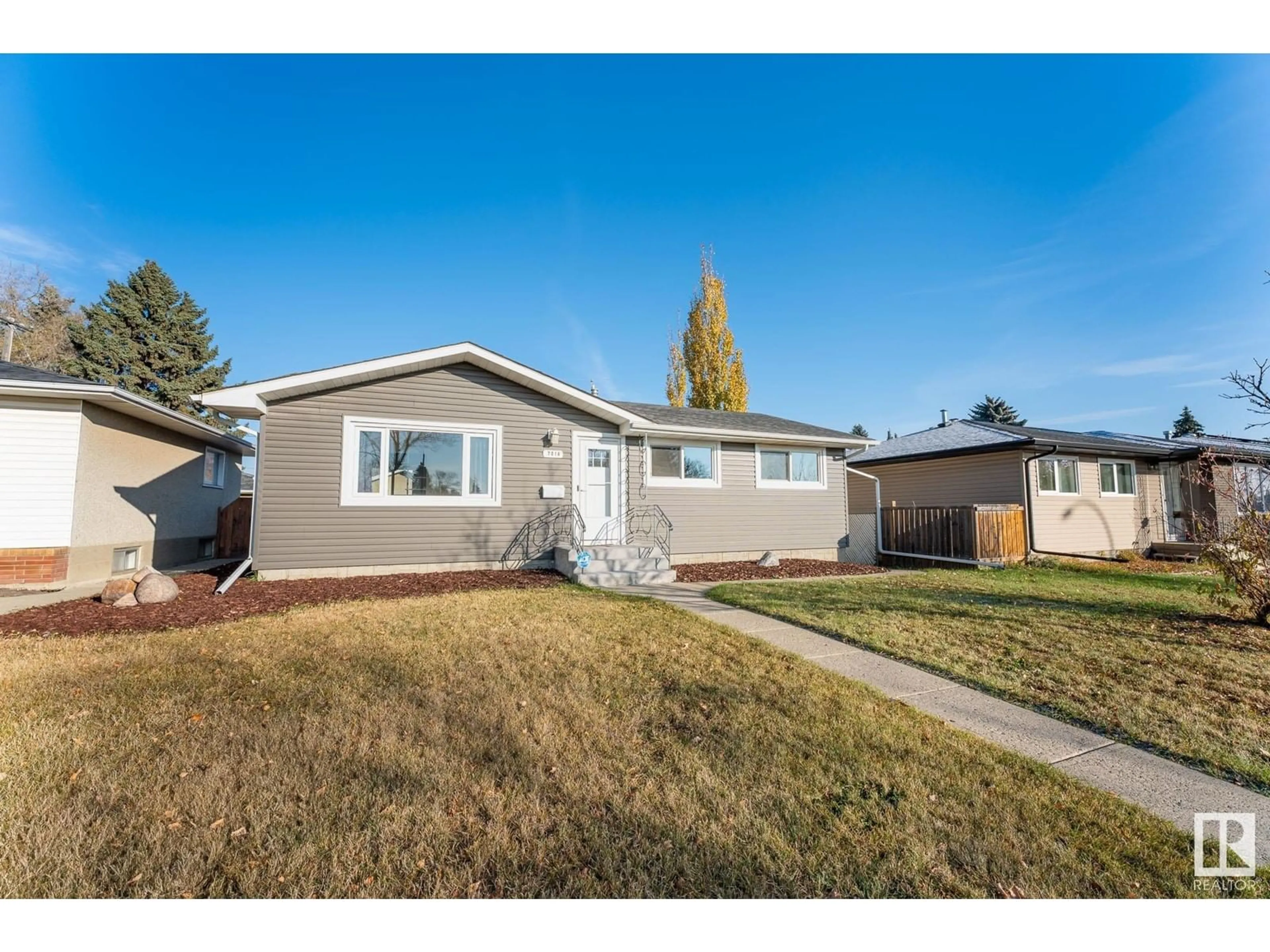 Frontside or backside of a home for 7016 90 AV NW, Edmonton Alberta T6B0P4