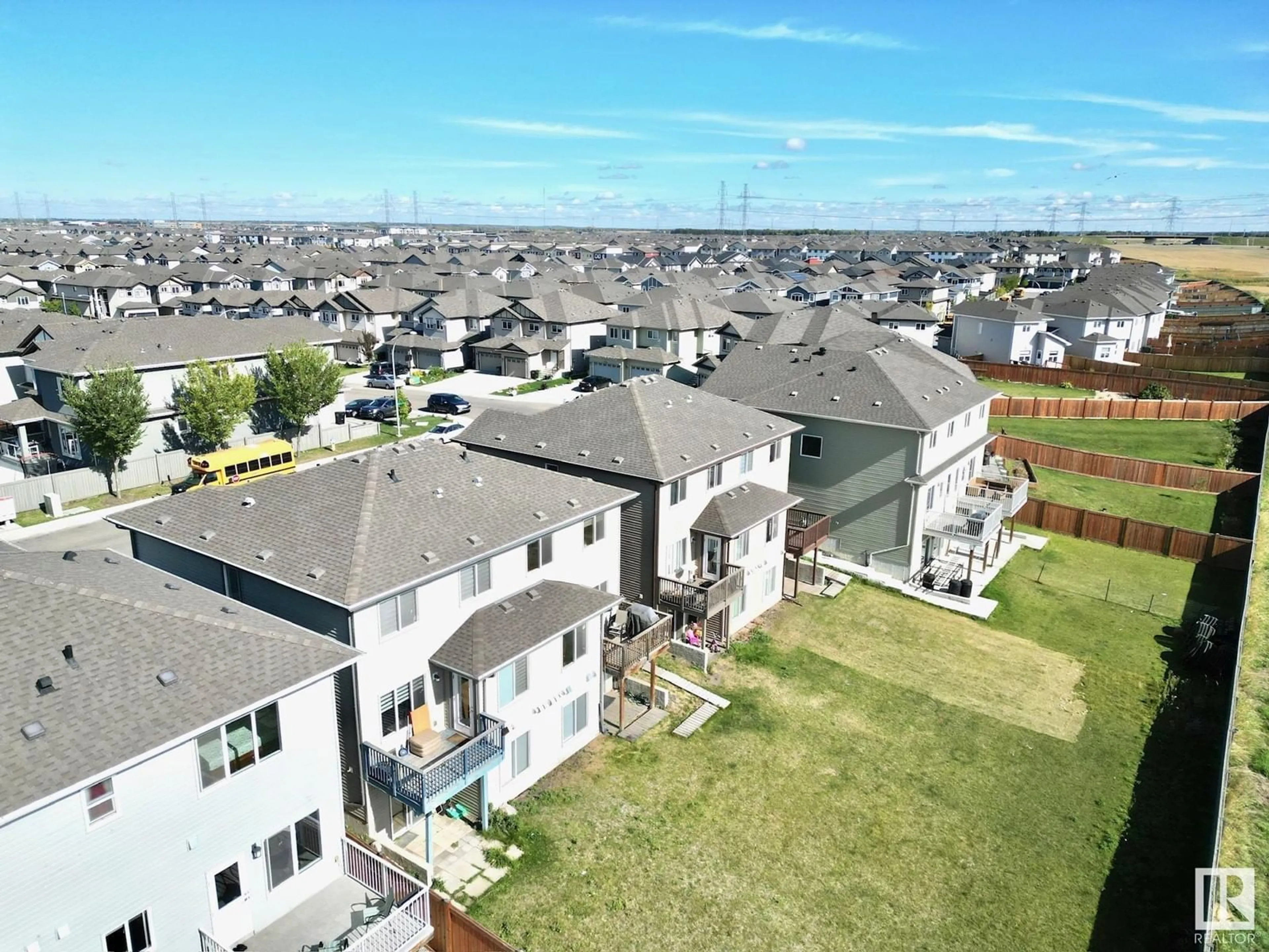 Frontside or backside of a home, the fenced backyard for 3117 11 AV NW, Edmonton Alberta T6T2C7