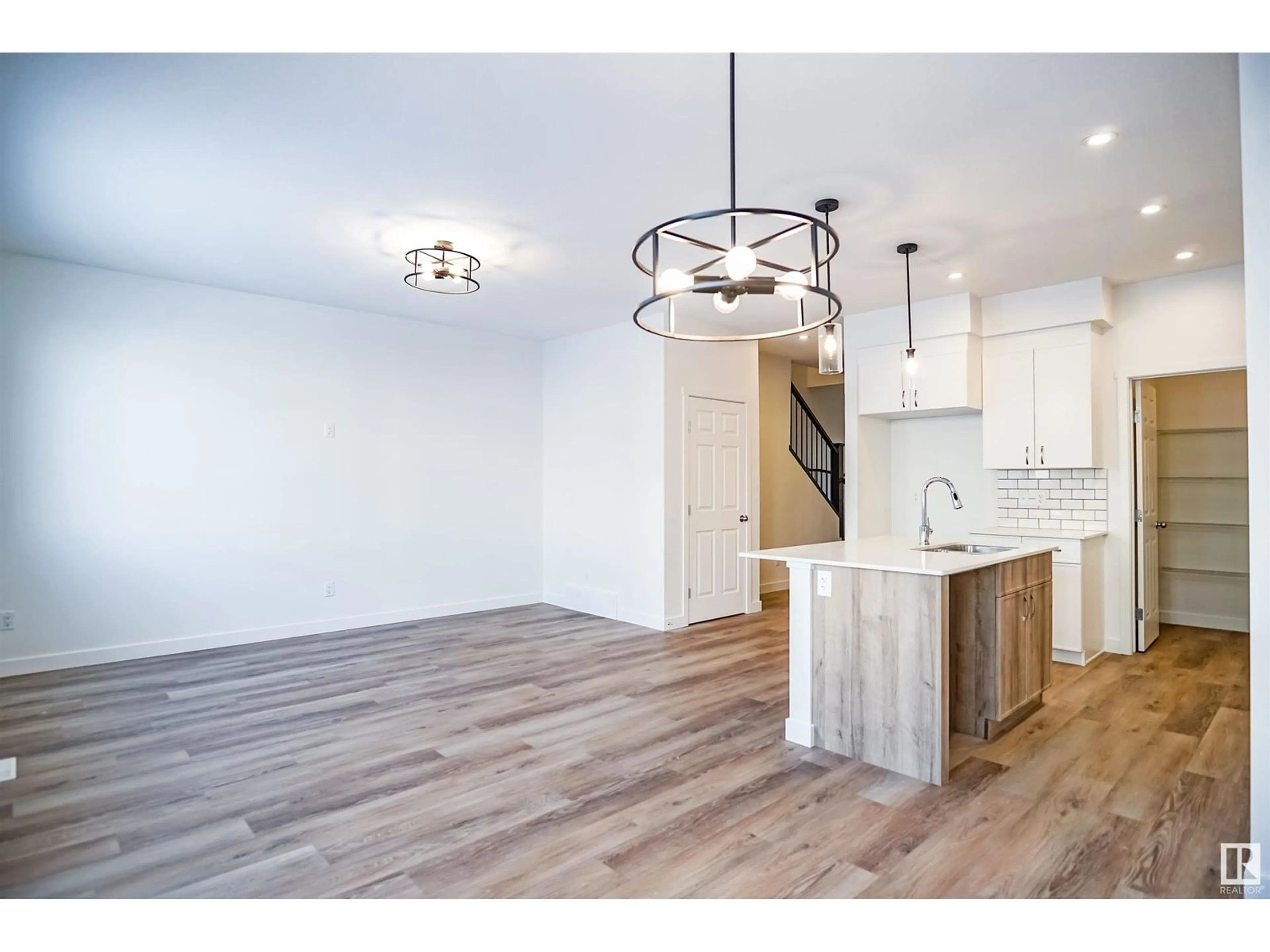 Open concept kitchen for 1308 13 AV NW, Edmonton Alberta T6T2N5