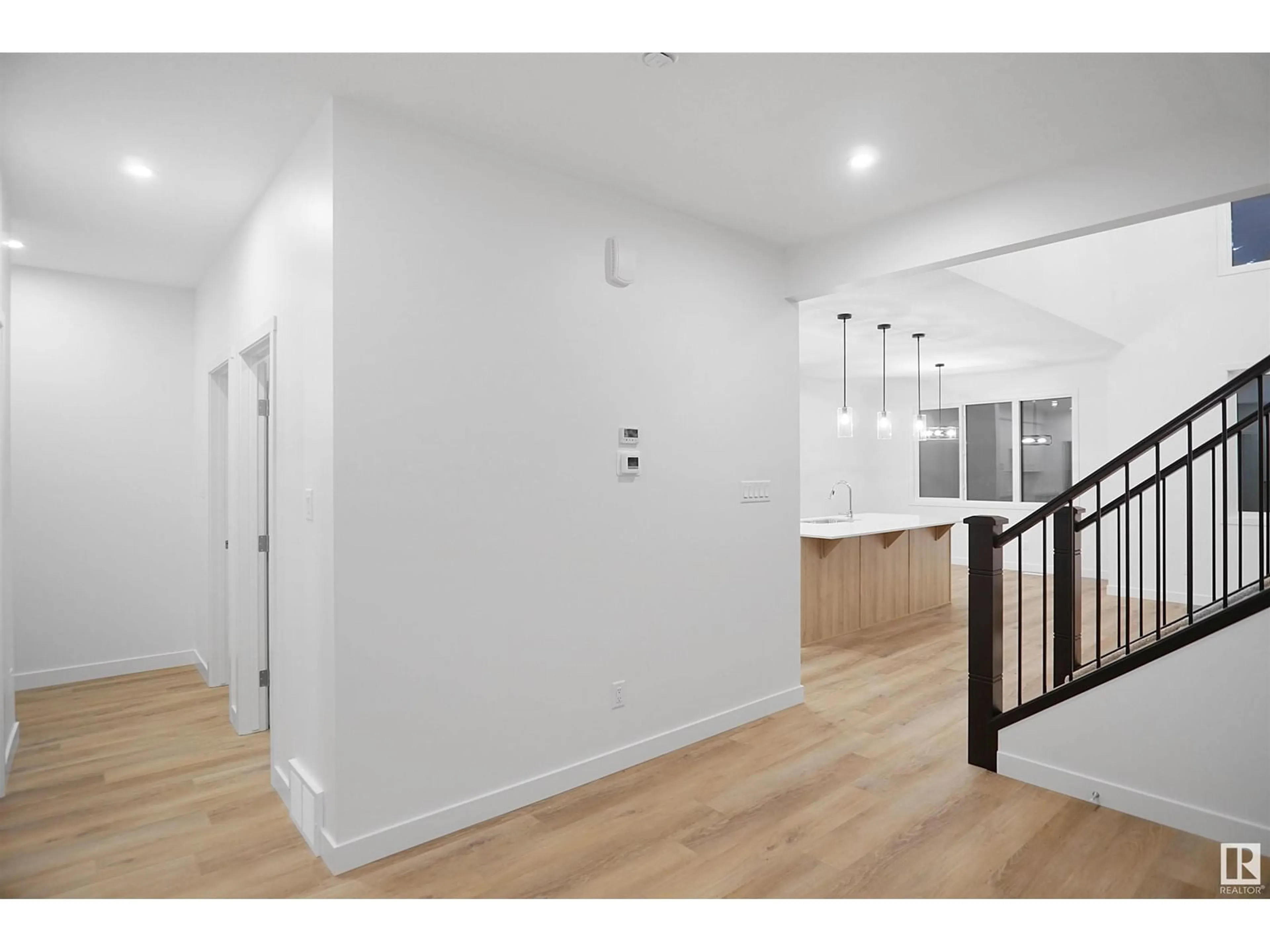 Indoor foyer, wood floors for 2603 15 AV NW, Edmonton Alberta T6T2N5