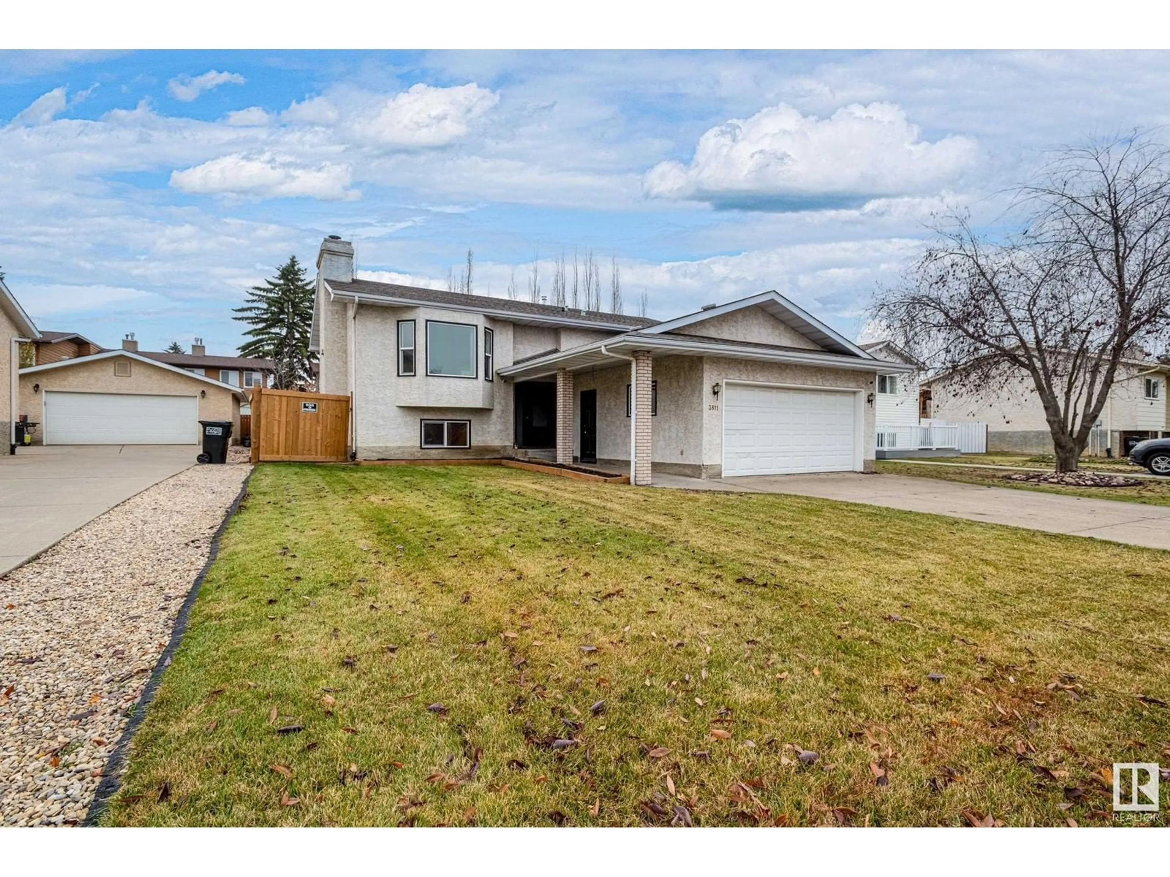 Frontside or backside of a home for 3811 21 AV NW, Edmonton Alberta T6L4T4