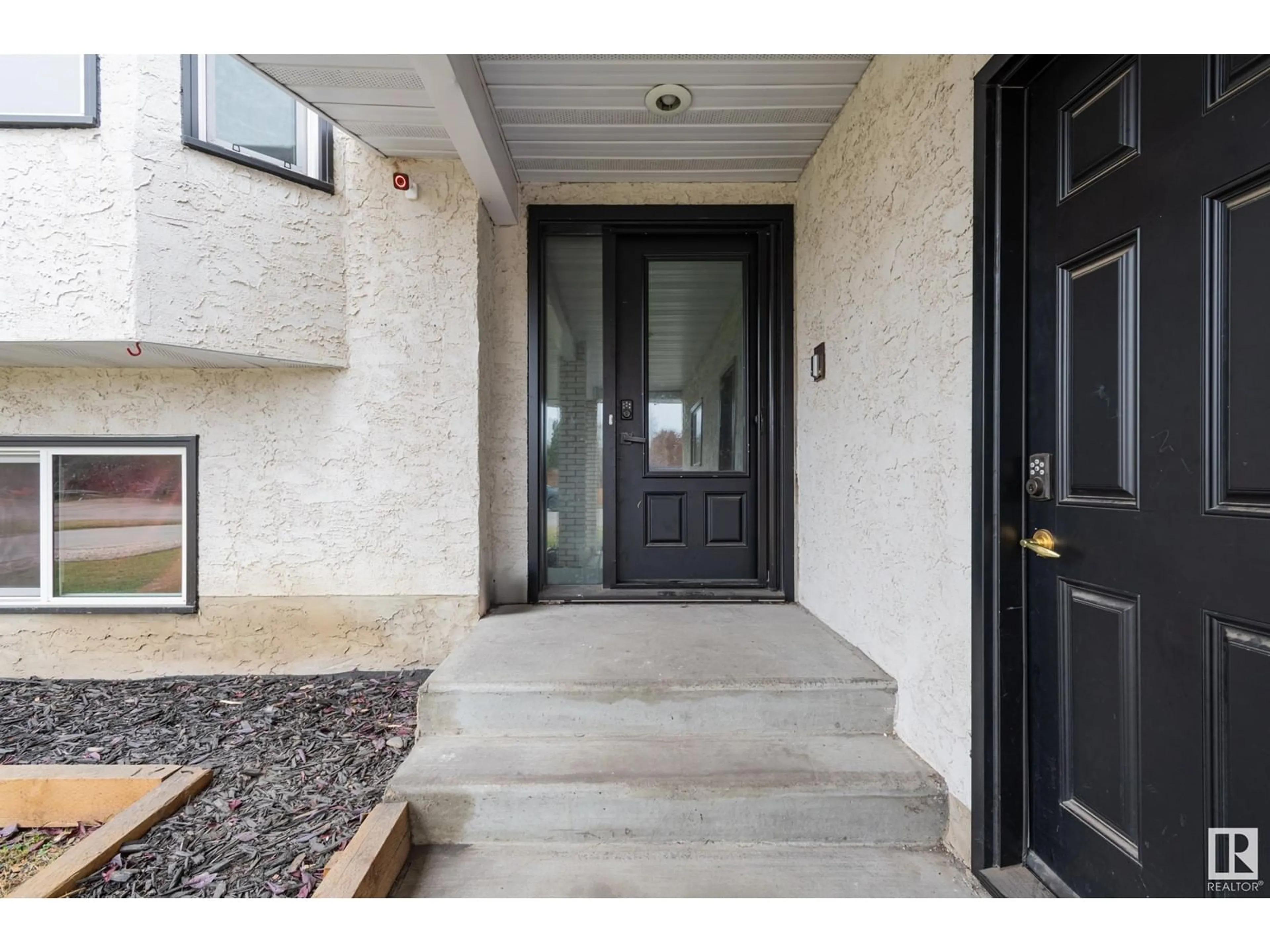 Indoor entryway, cement floor for 3811 21 AV NW, Edmonton Alberta T6L4T4