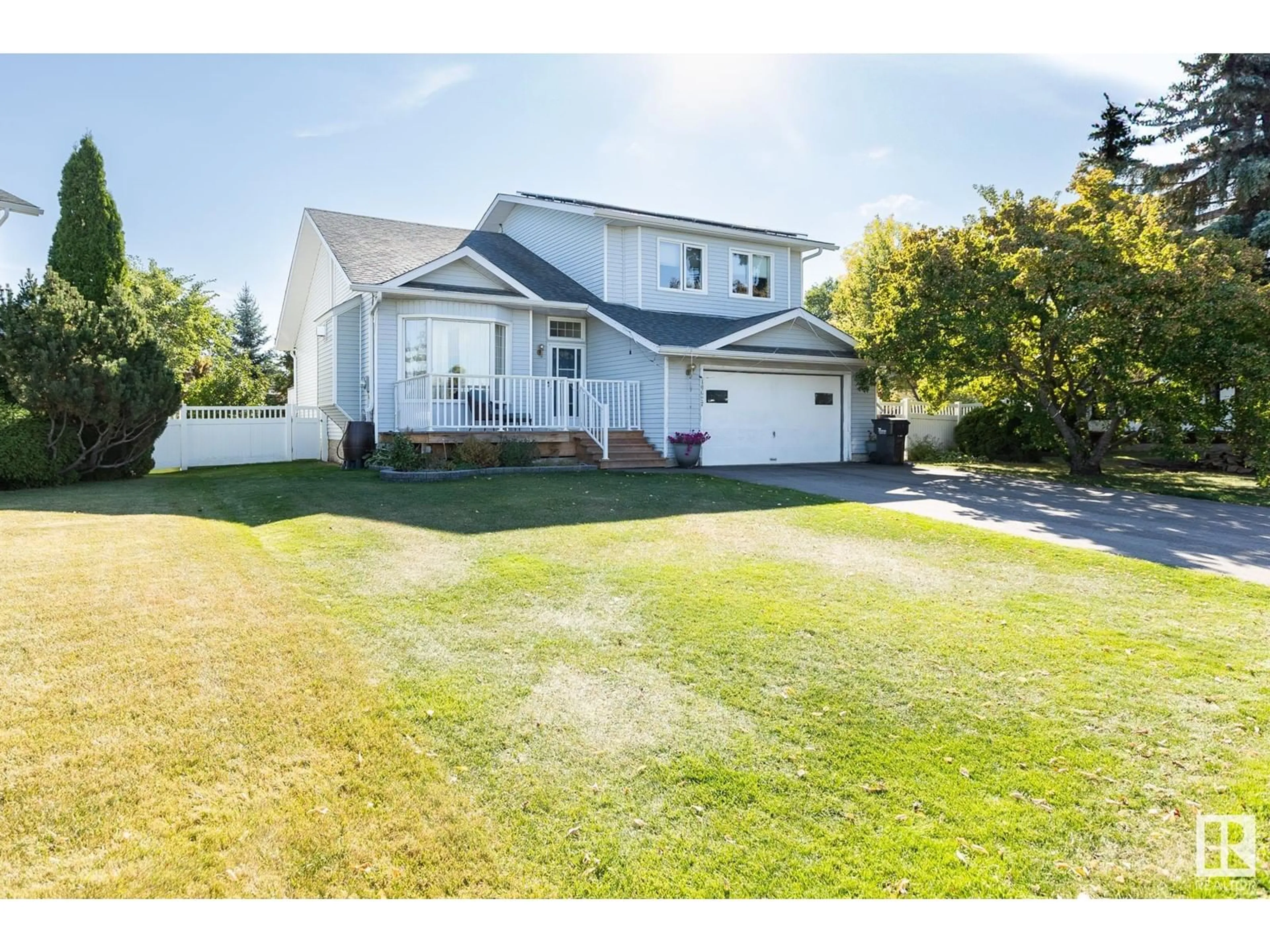 Frontside or backside of a home, the fenced backyard for 10627 108 ST, Westlock Alberta T7P1E1