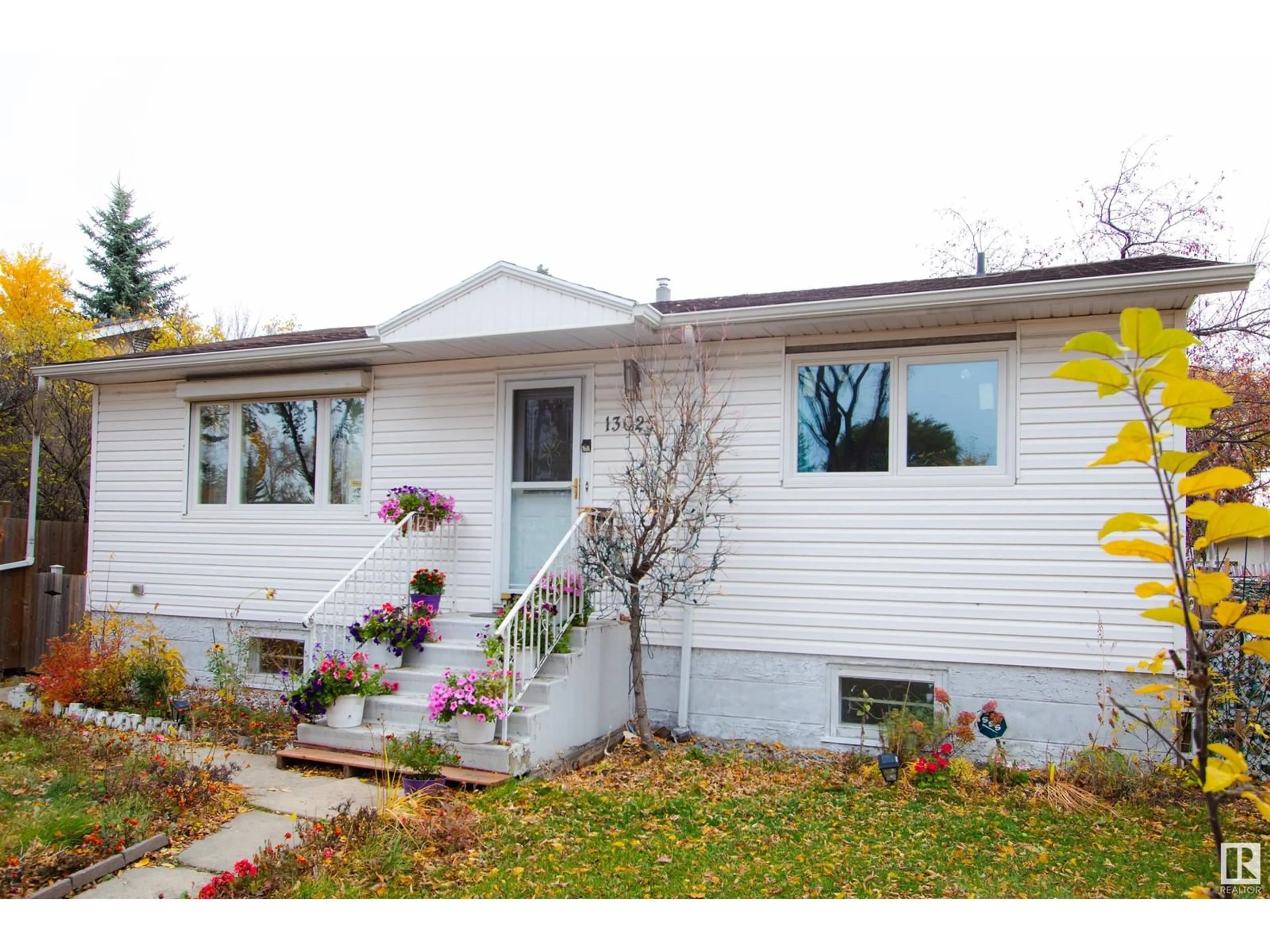 Home with vinyl exterior material for 13025 124 ST NW, Edmonton Alberta T5L0P8