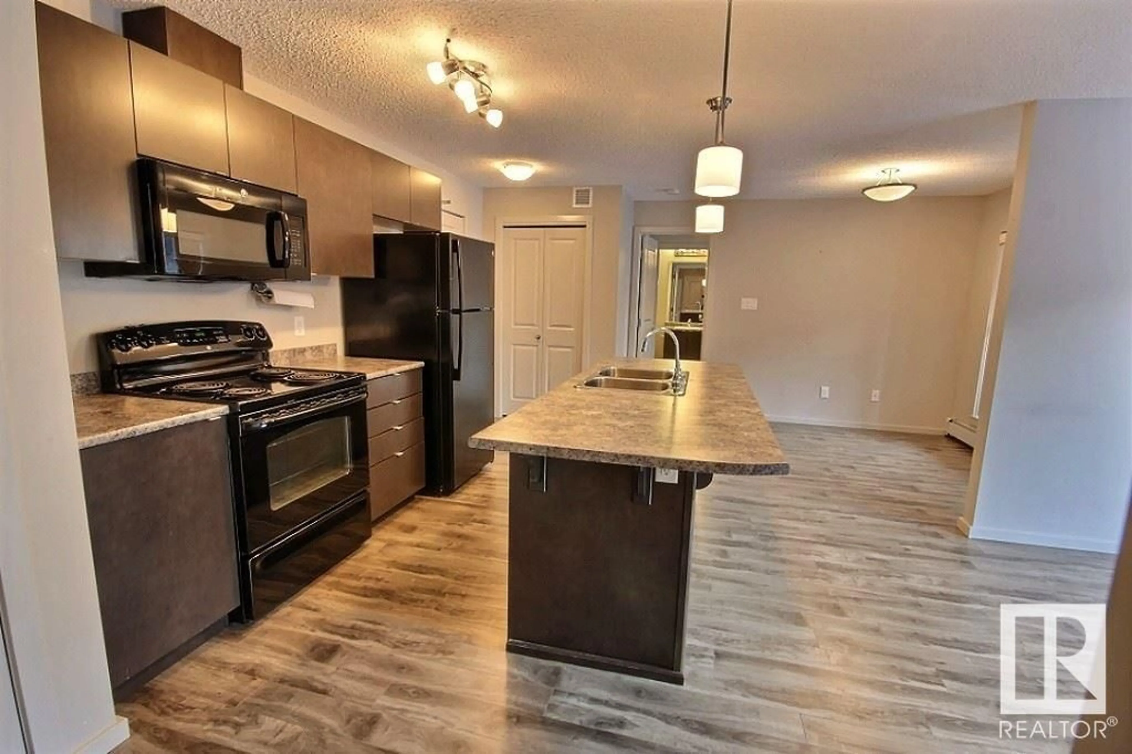 Open concept kitchen for #221 344 WINDERMERE RD NW, Edmonton Alberta T6W2P2