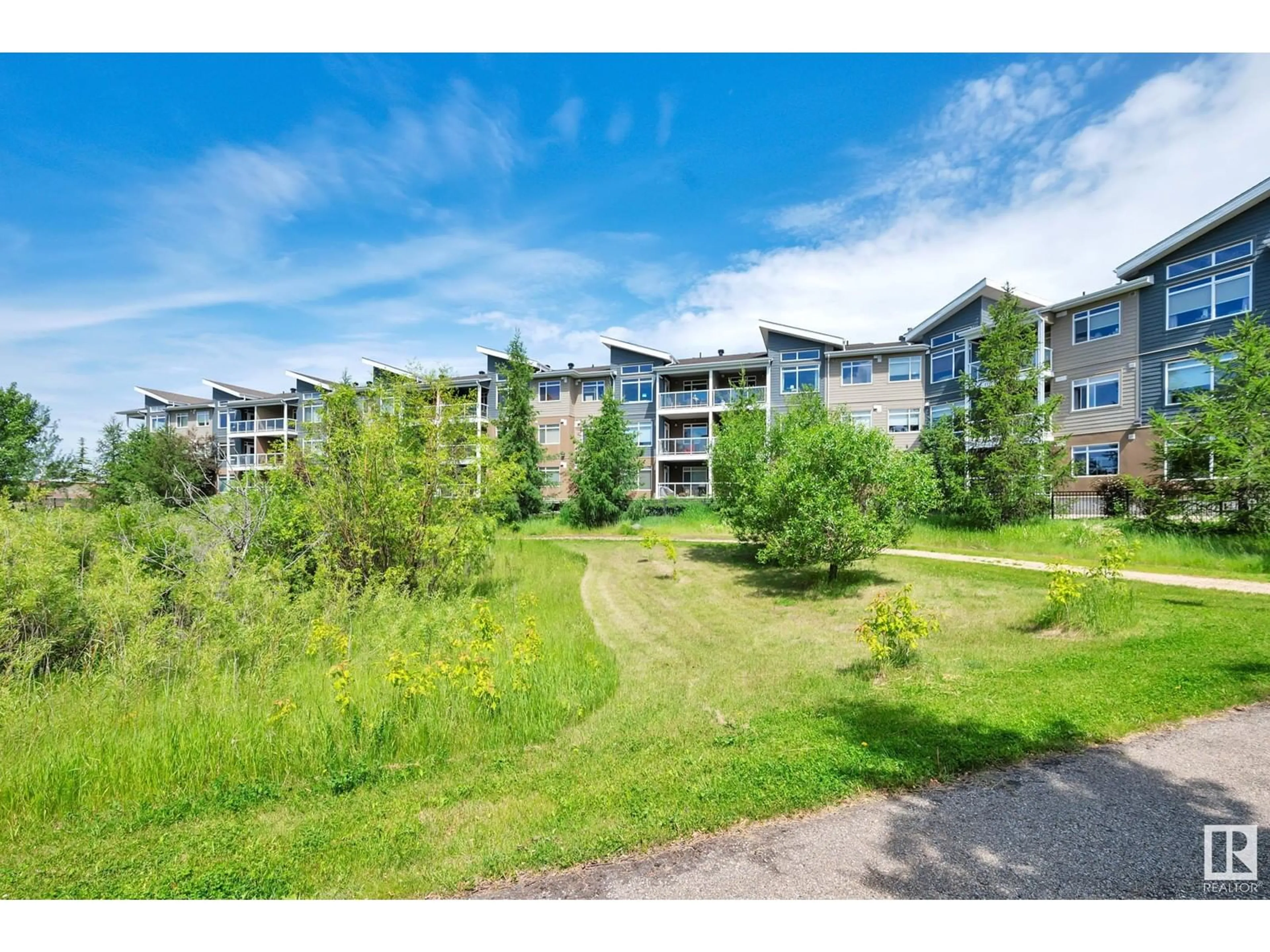 A pic from exterior of the house or condo, the fenced backyard for #215 279 WYE RD, Sherwood Park Alberta T8B0A7