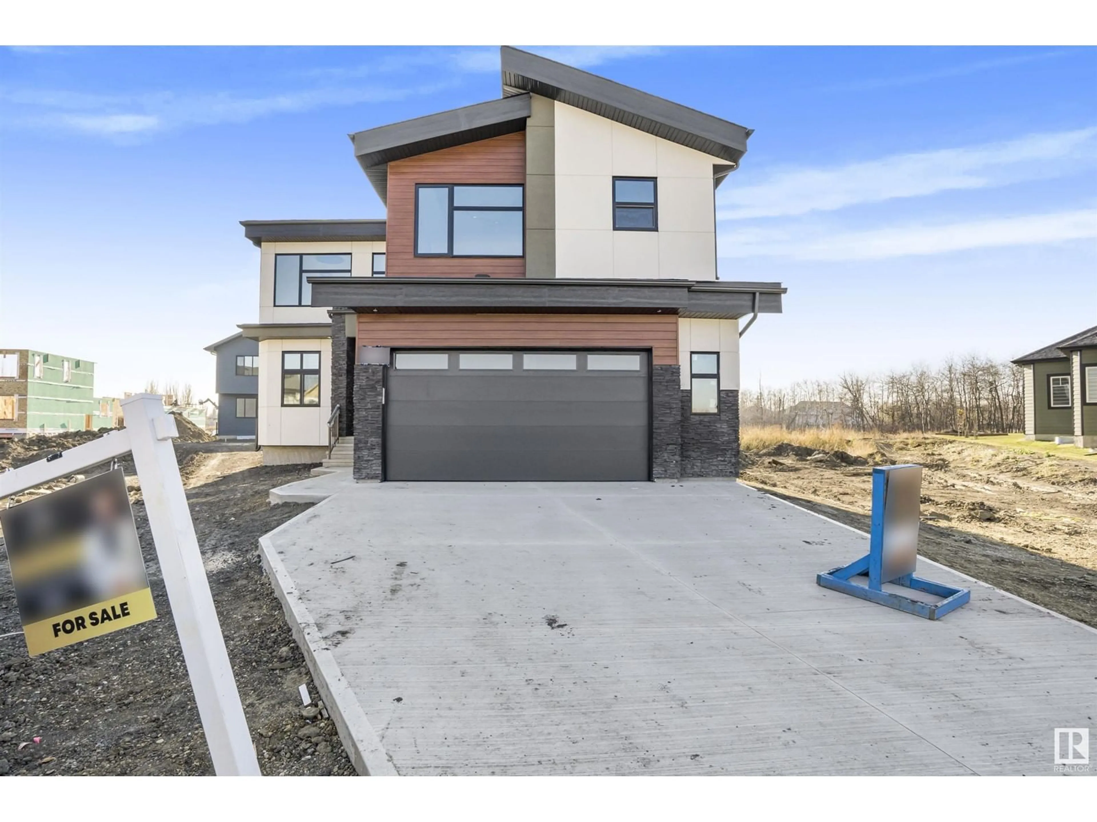 Frontside or backside of a home, the street view for 235 166 AV NE, Edmonton Alberta T5Y4J2