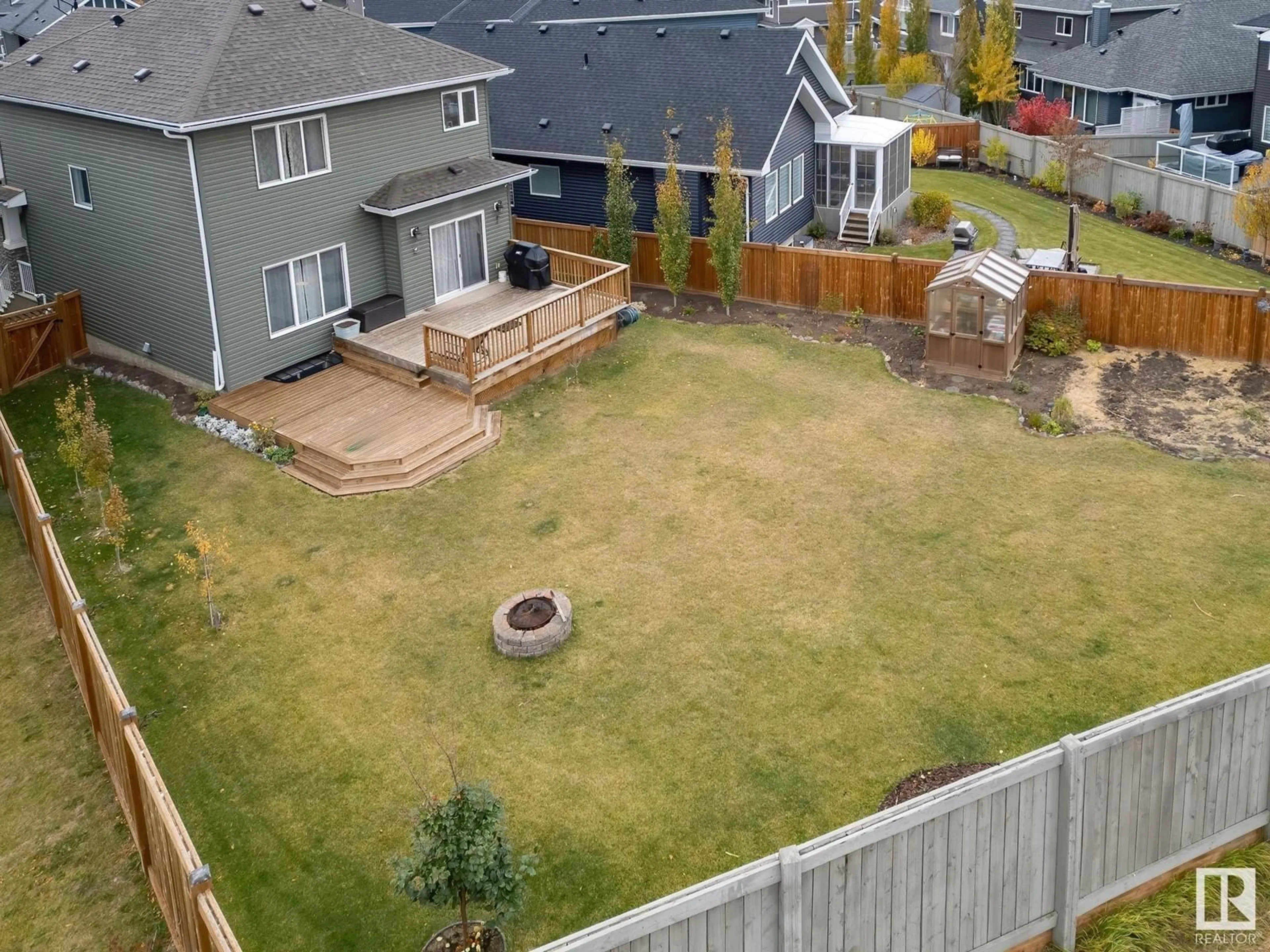 Frontside or backside of a home, the fenced backyard for 1814 Tanager Cl NW, Edmonton Alberta T5S0N2