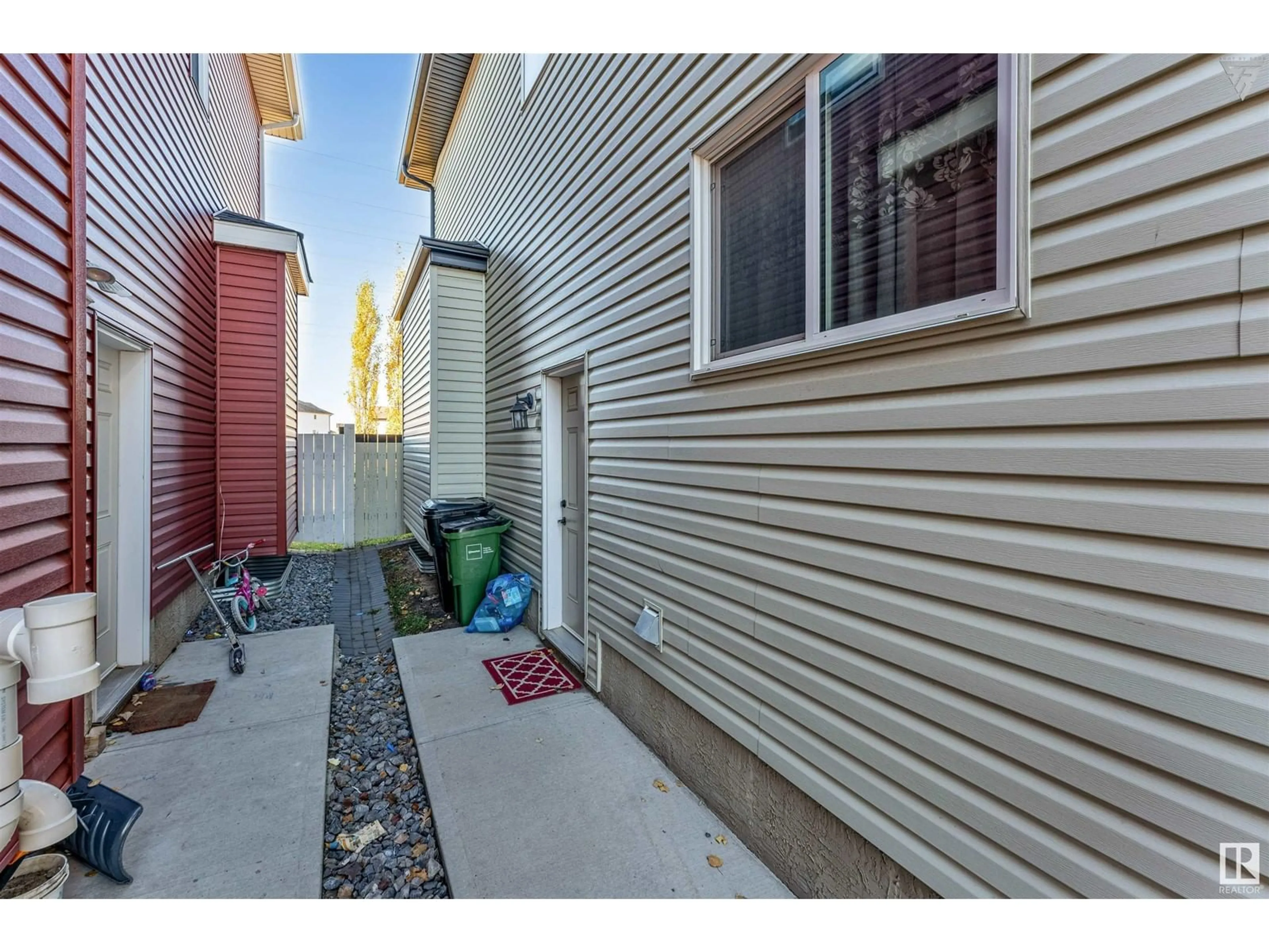 A pic from exterior of the house or condo, the fenced backyard for 2104 27 ST NW NW, Edmonton Alberta T6T0Y6