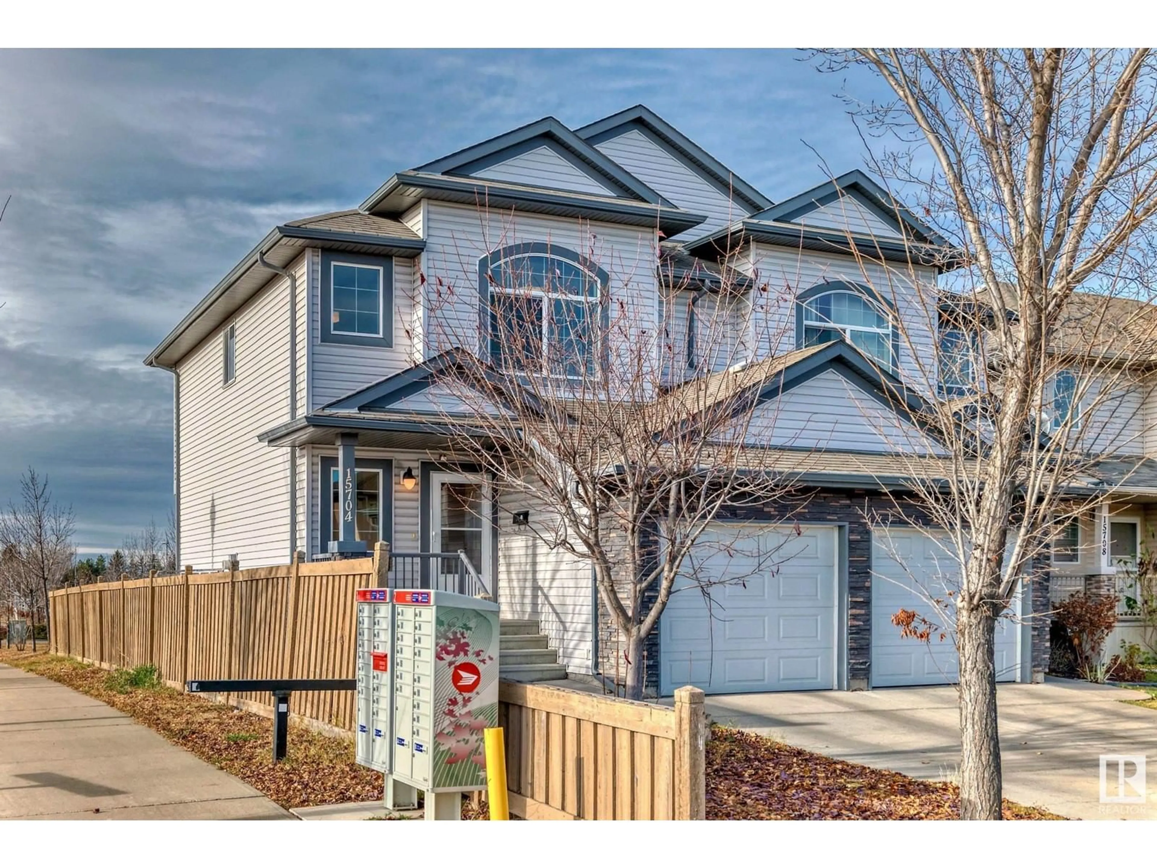 Frontside or backside of a home, the fenced backyard for 15704 95 ST NW, Edmonton Alberta T5Z0G2