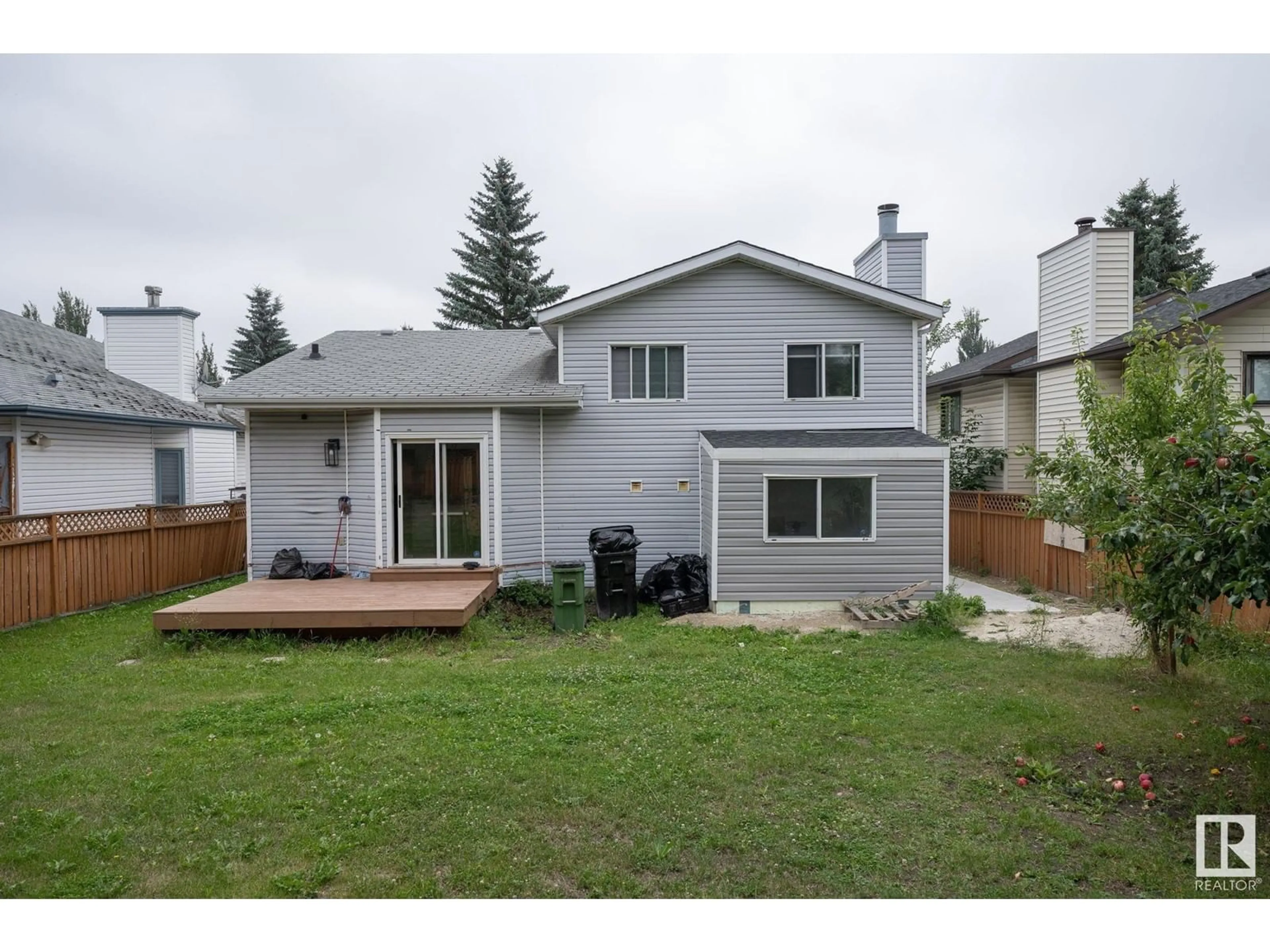 Frontside or backside of a home, the fenced backyard for 1508 48 ST NW, Edmonton Alberta T6L6H9