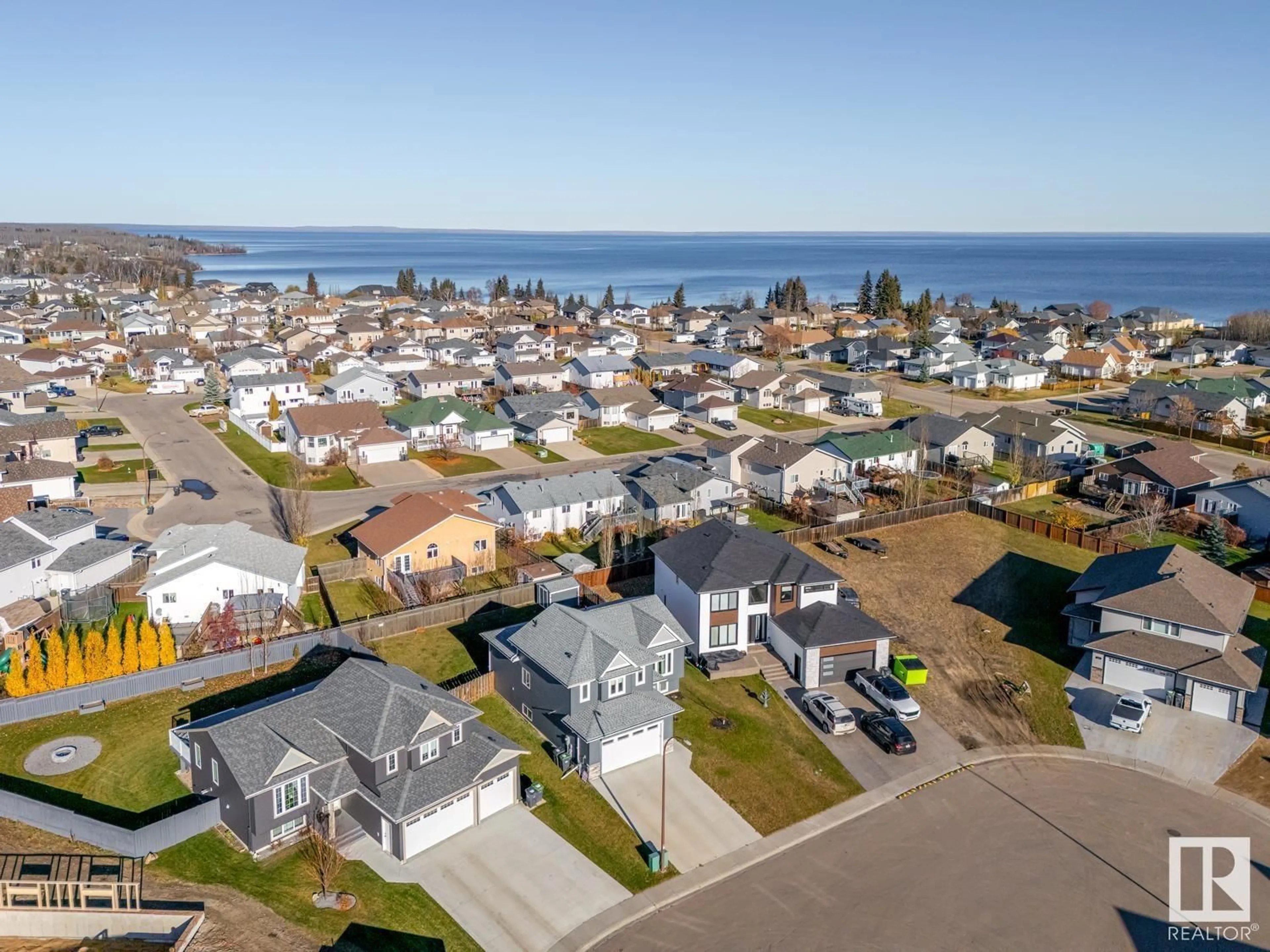 A pic from outside/outdoor area/front of a property/back of a property/a pic from drone, water/lake/river/ocean view for 520 LAKEWOOD CL, Cold Lake Alberta T9M0E9