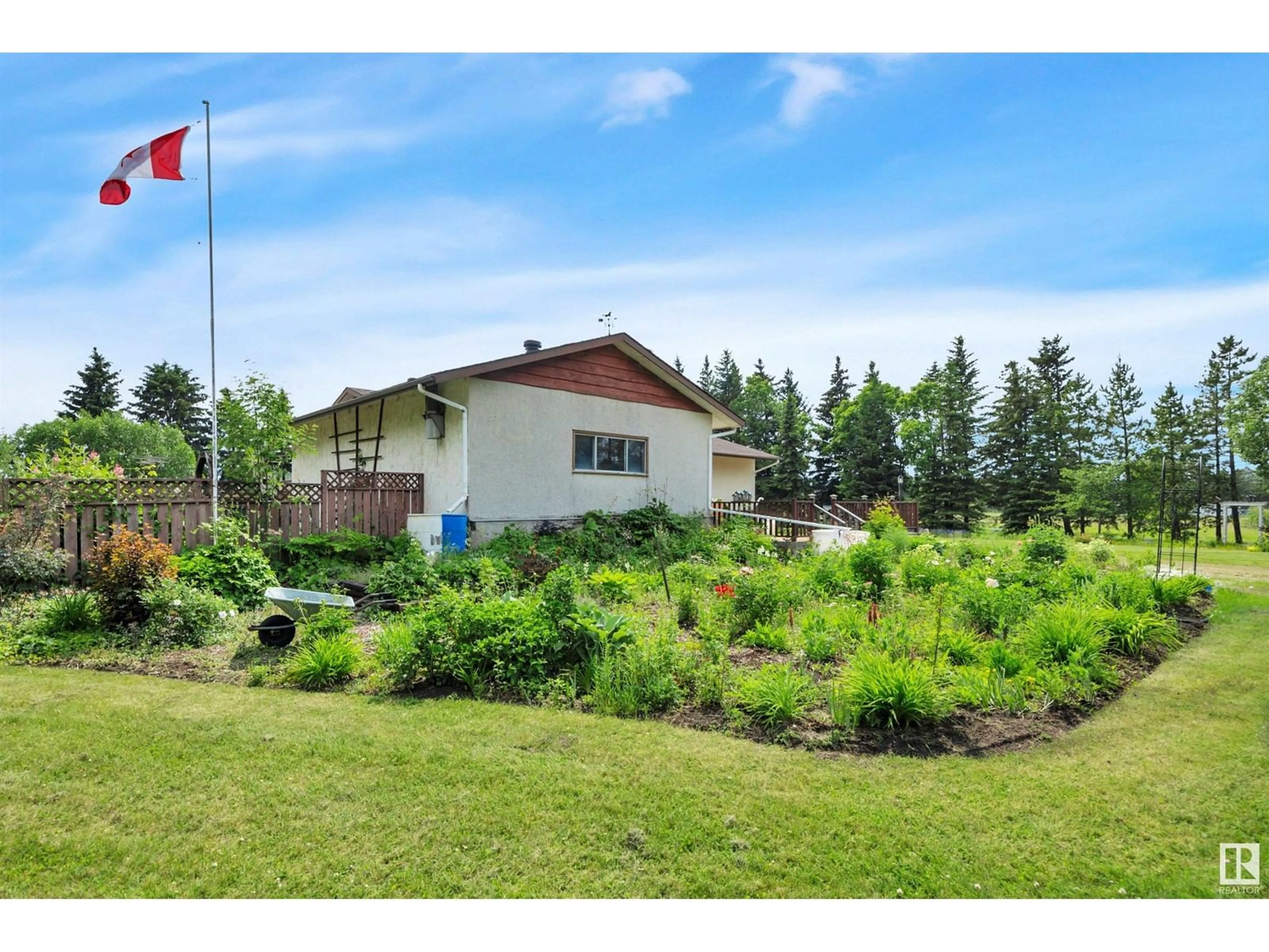 A pic from exterior of the house or condo, the fenced backyard for 243023 TWP RD 474, Rural Wetaskiwin County Alberta T0C1Z0