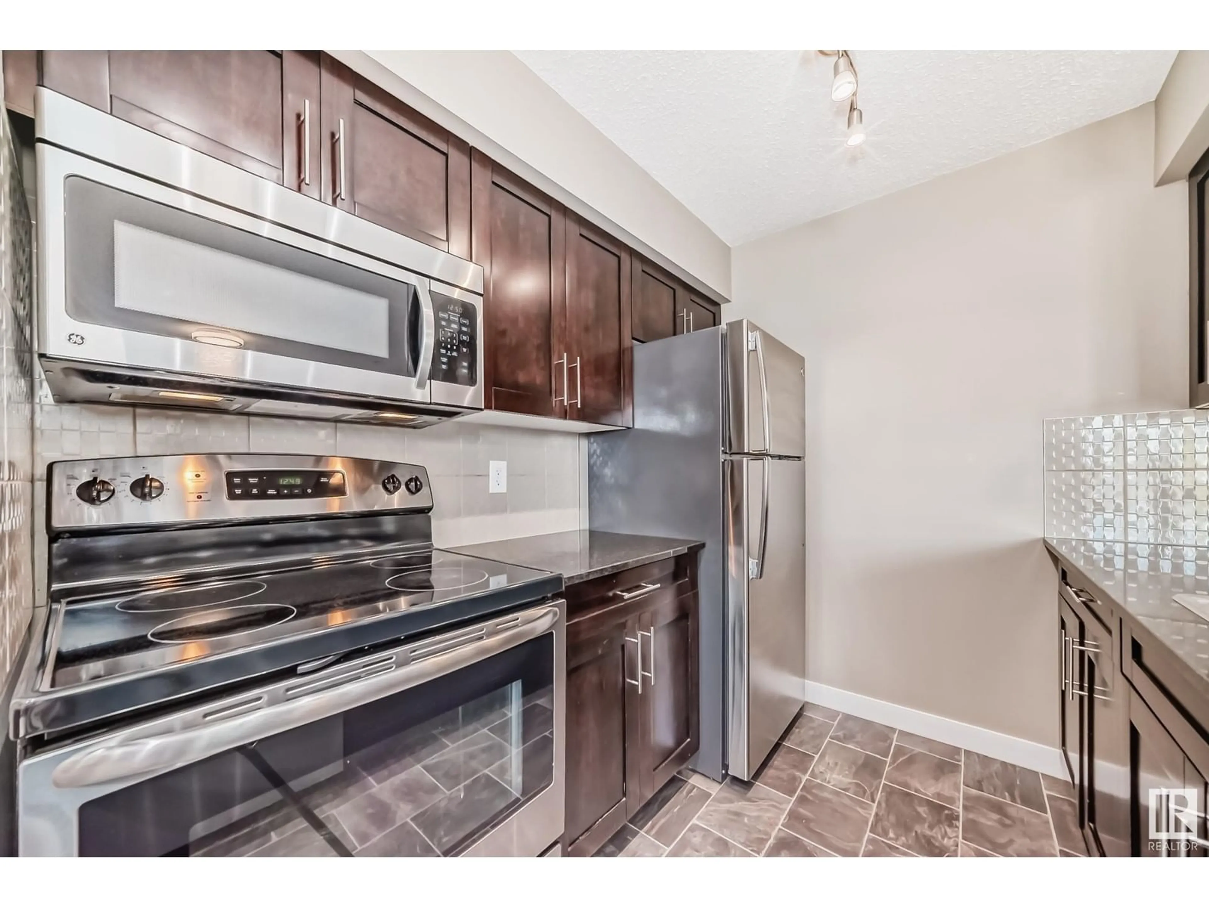 Standard kitchen, wood floors for #325 270 McConachie DR NW, Edmonton Alberta T5Y3N4