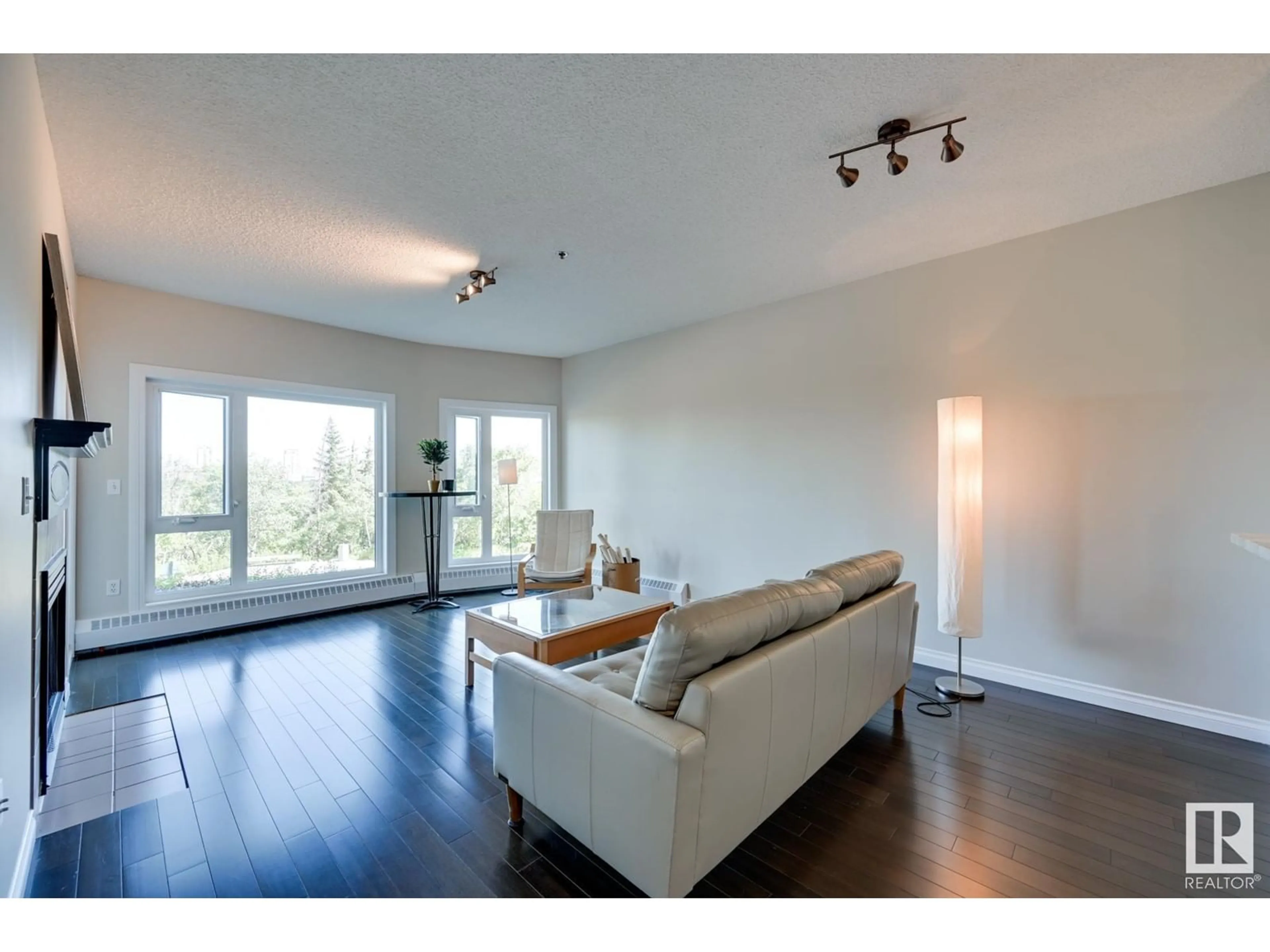 Living room, wood floors for #202 10809 SASKATCHEWAN DR NW, Edmonton Alberta T6E4S5