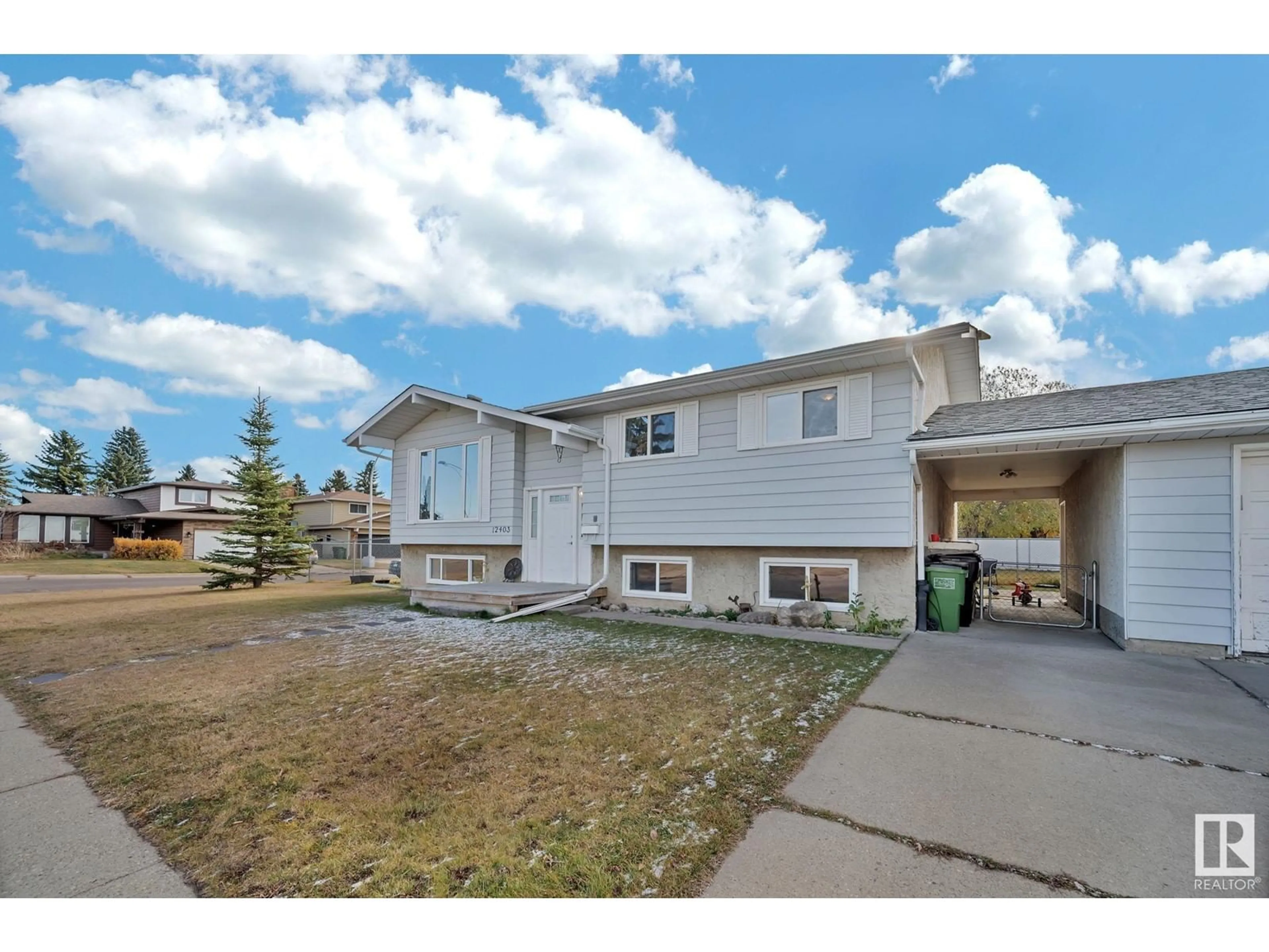 Frontside or backside of a home, the fenced backyard for 12403 159 AV NW, Edmonton Alberta T5X2Y4