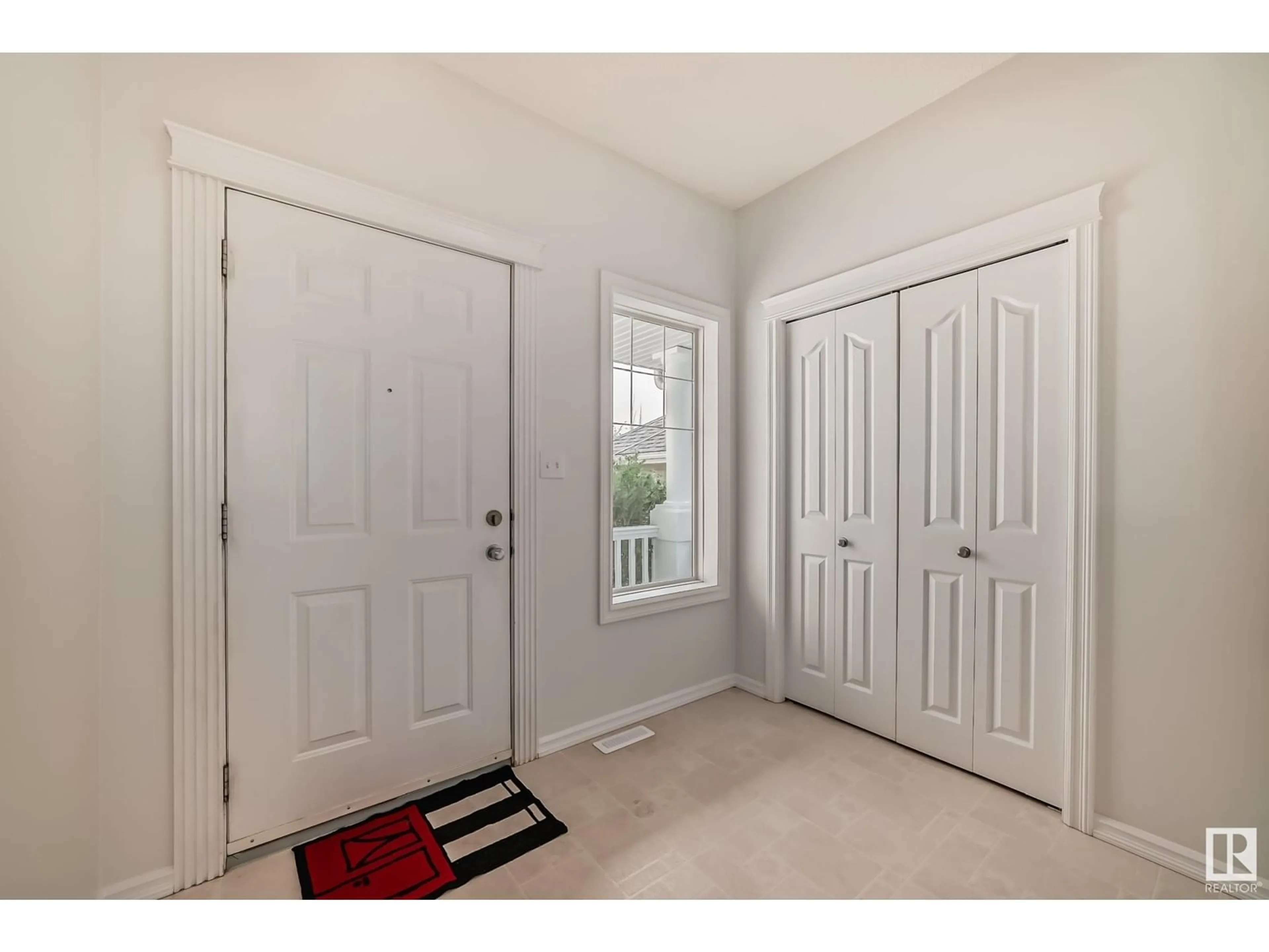 Indoor entryway, wood floors for 8314 12 AV SW, Edmonton Alberta T6X1E3