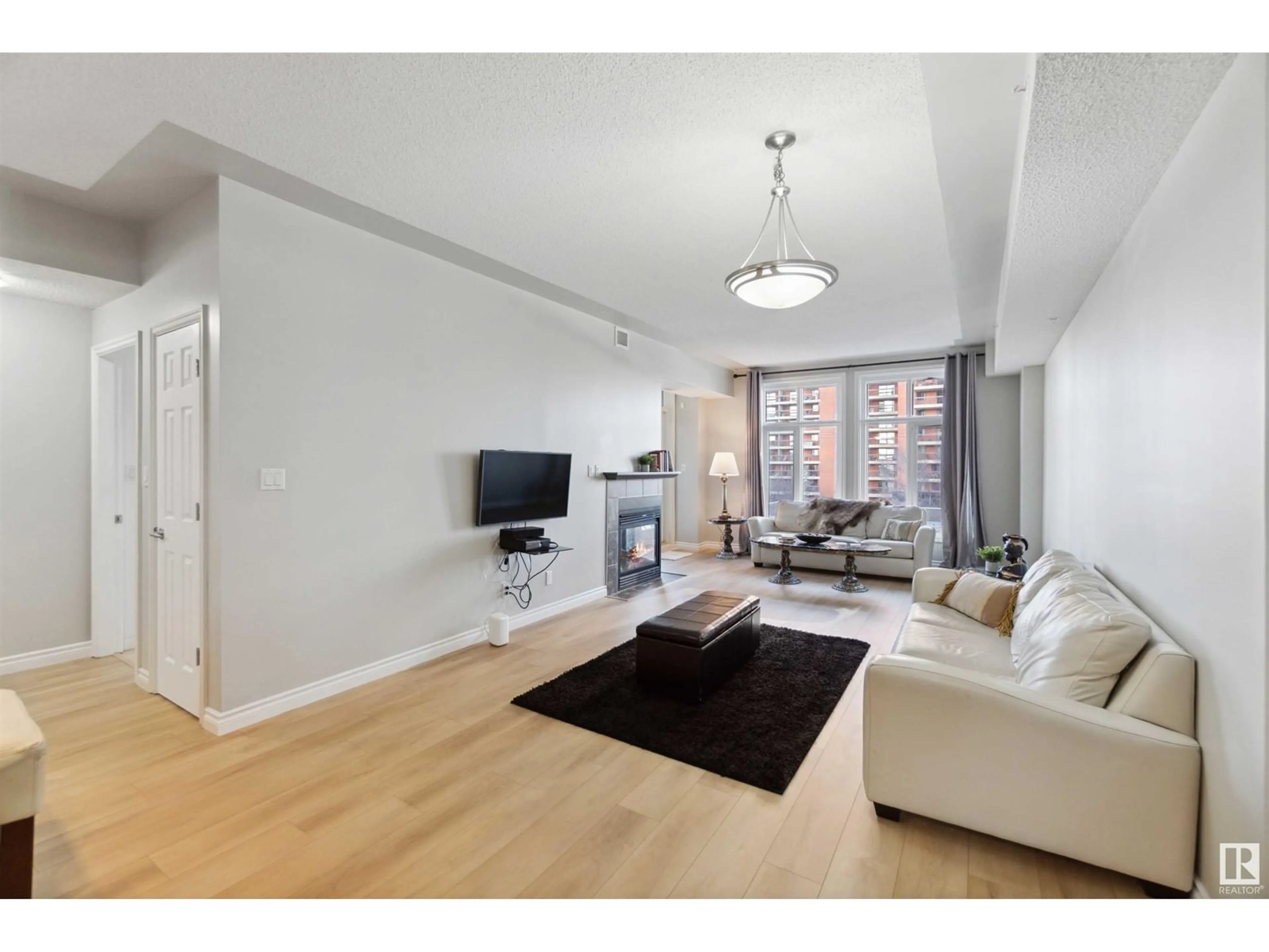 Living room, wood floors for #402 9020 JASPER AV NW, Edmonton Alberta T5H3S8