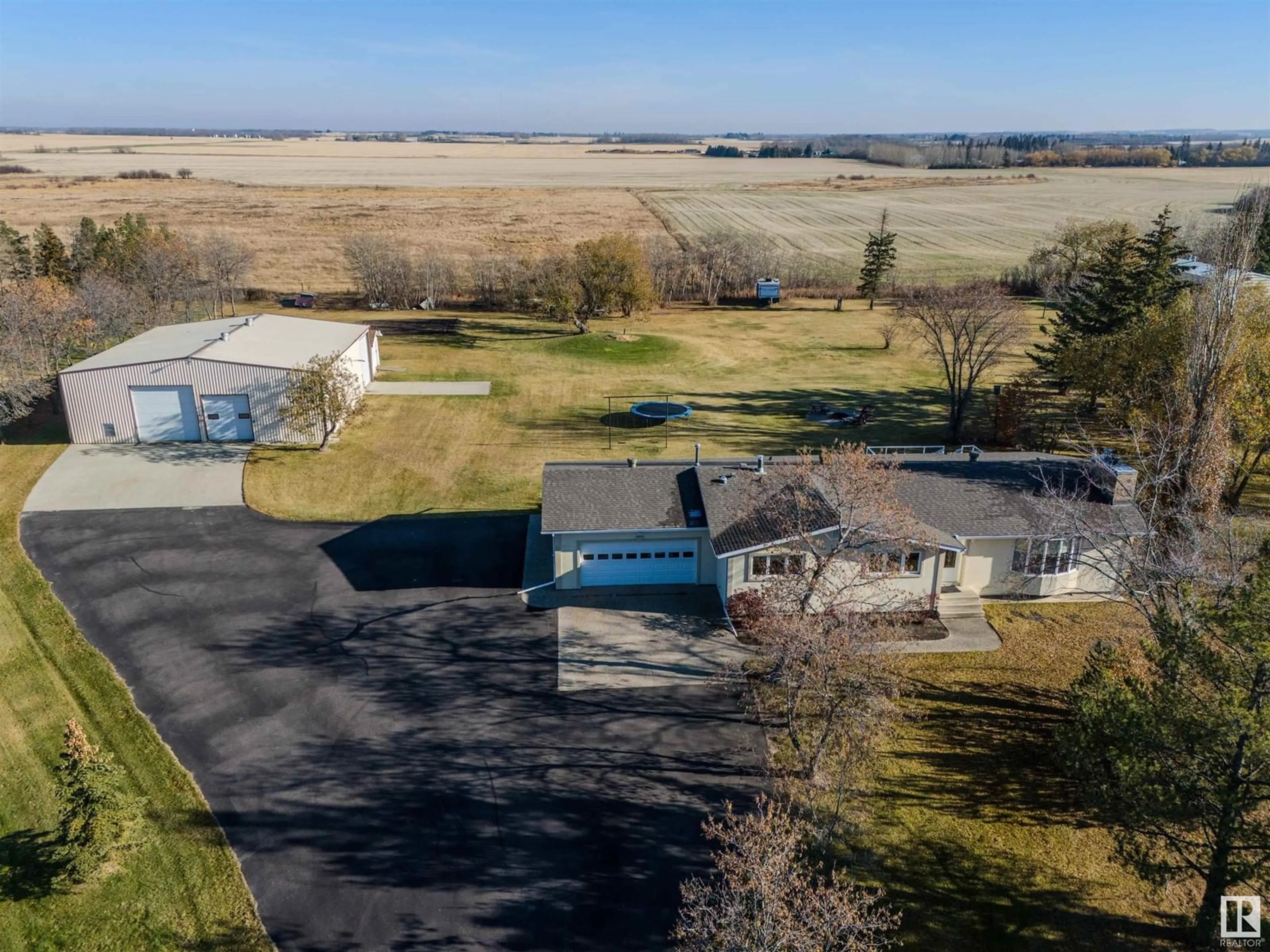 Frontside or backside of a home, the front or back of building for #1130 50242 RGE ROAD 244 A, Rural Leduc County Alberta T4X0P4