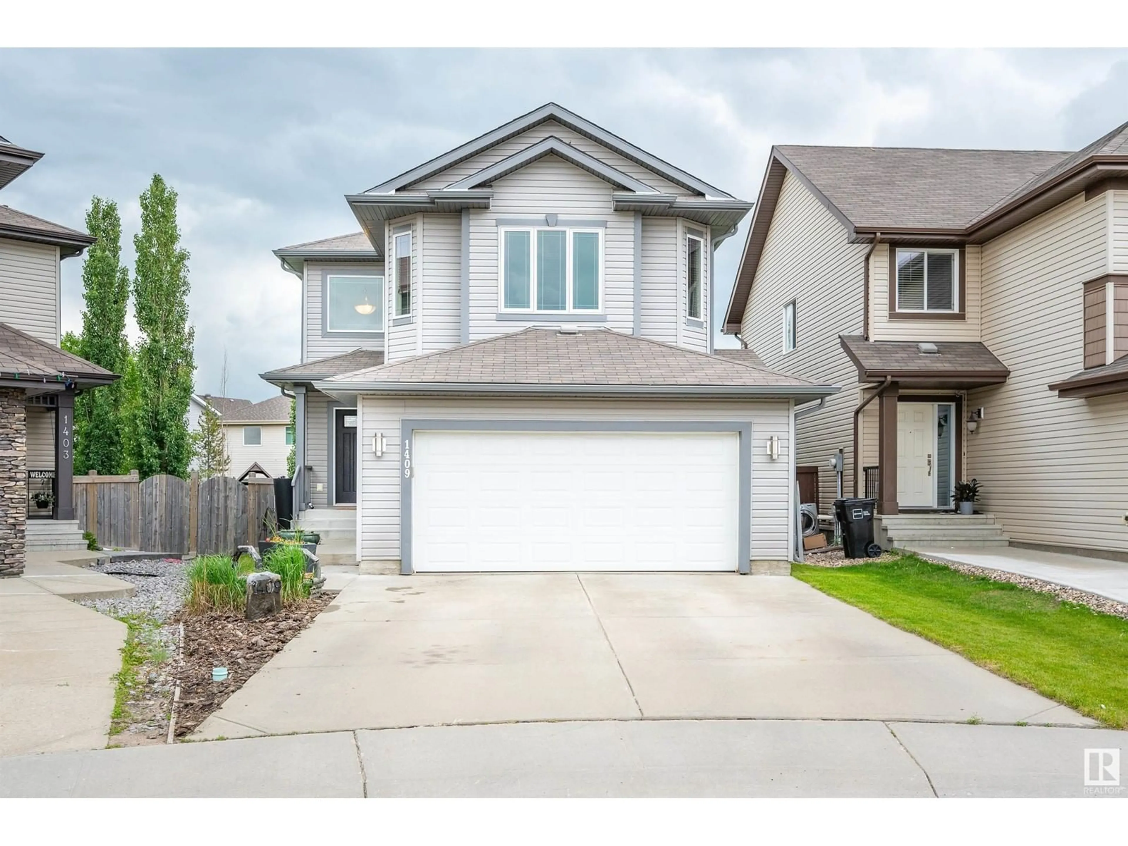 Frontside or backside of a home, the street view for 1409 37A AV NW, Edmonton Alberta T6T0H9