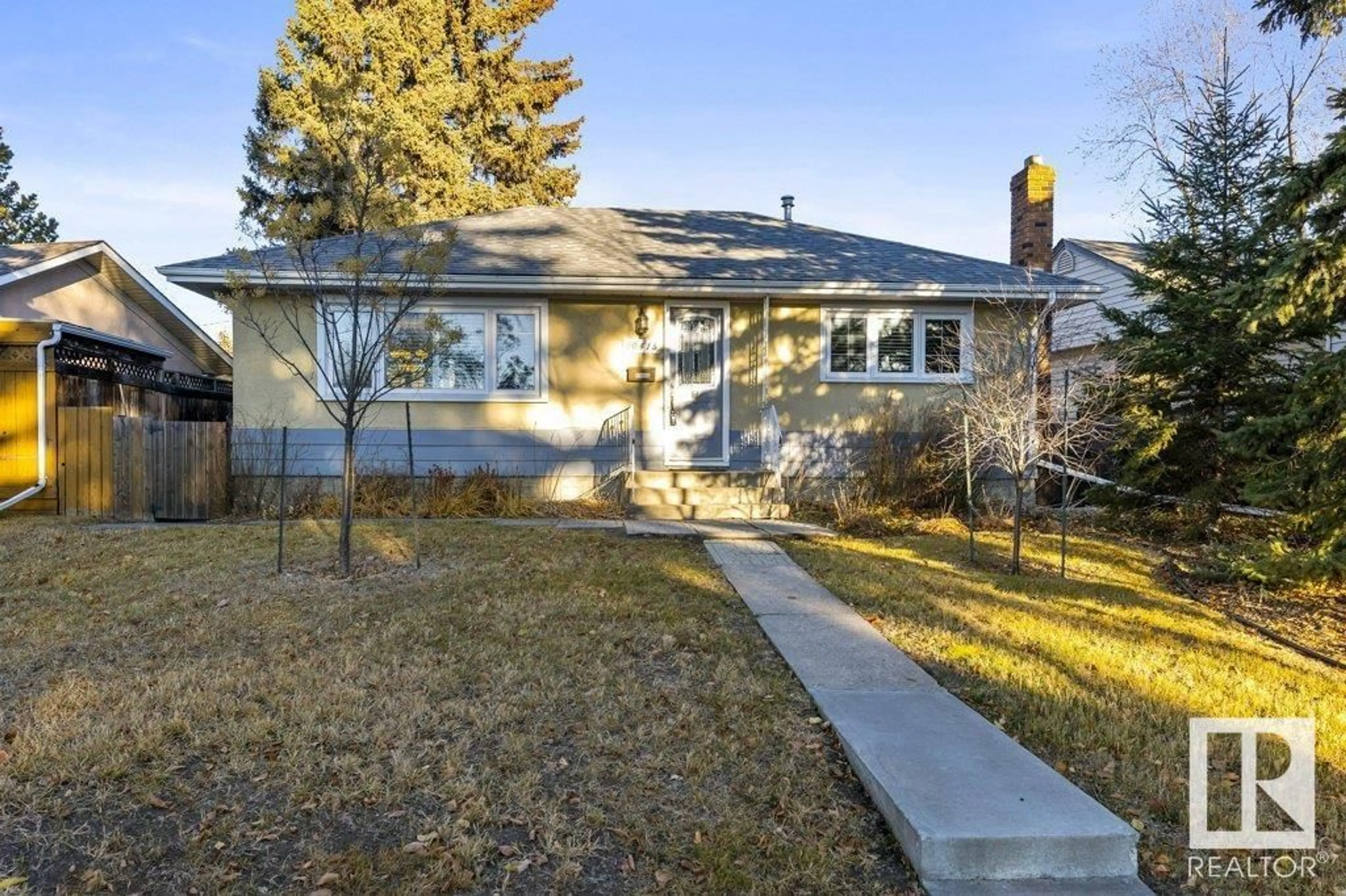 Frontside or backside of a home, the fenced backyard for 10415 62 ST NW, Edmonton Alberta T6A2M2