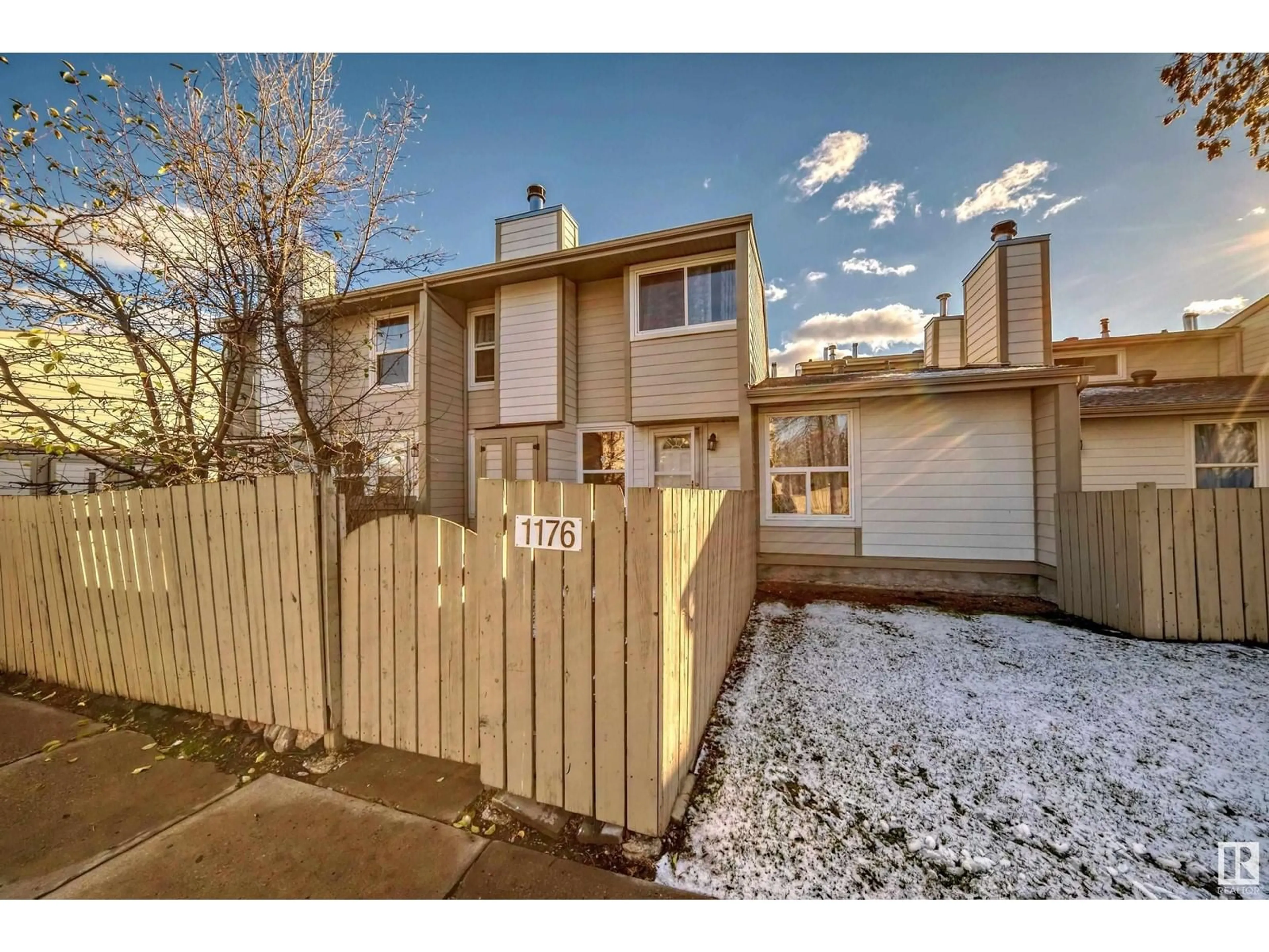 A pic from exterior of the house or condo, the fenced backyard for 1176 KNOTTWOOD RD E NW, Edmonton Alberta T6K2J8