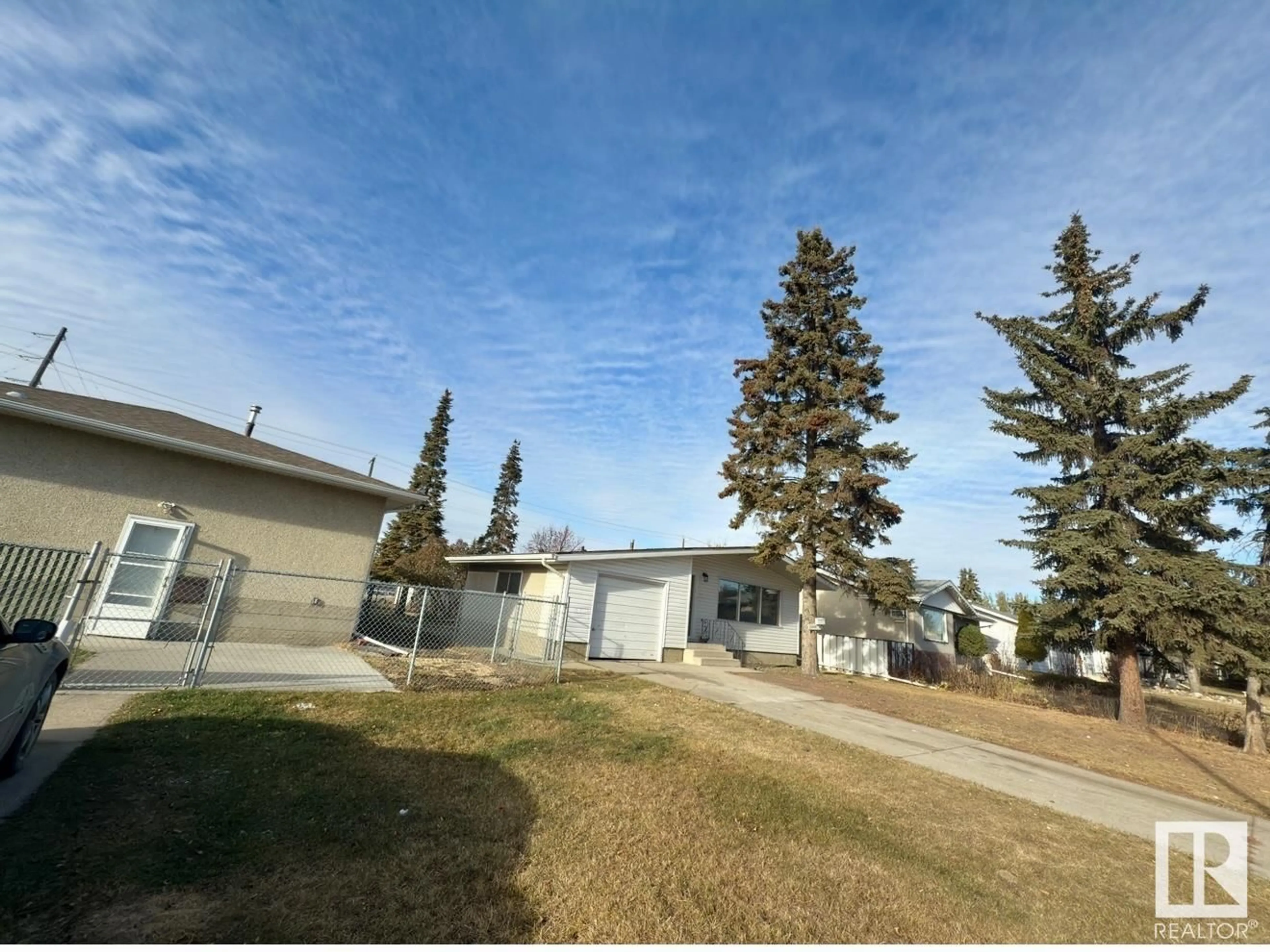 A pic from exterior of the house or condo, the front or back of building for 13208 102 ST NW, Edmonton Alberta T5E4J8