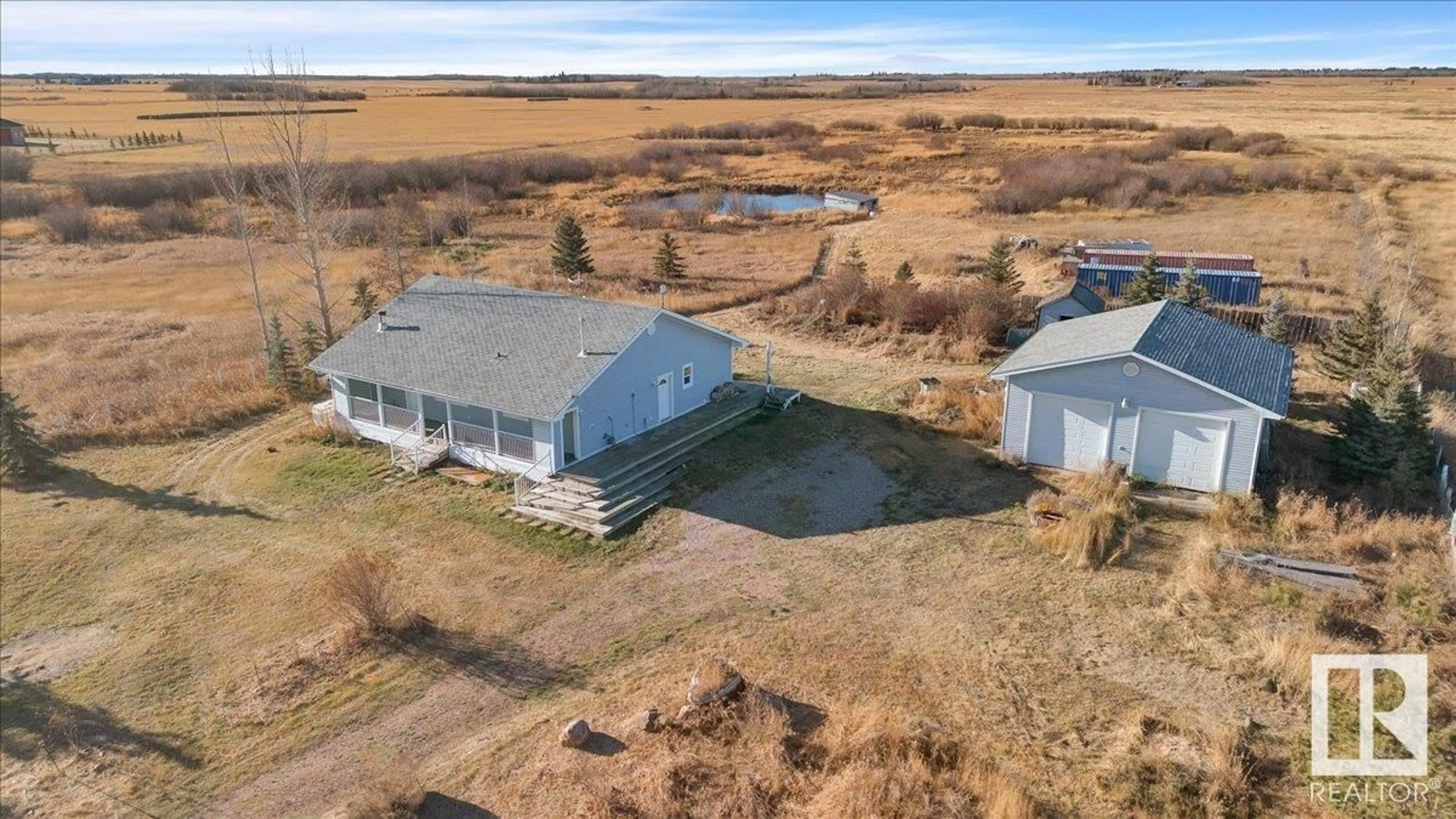 A pic from exterior of the house or condo, the fenced backyard for 57510 RGE RD 222, Rural Sturgeon County Alberta T0A2W0