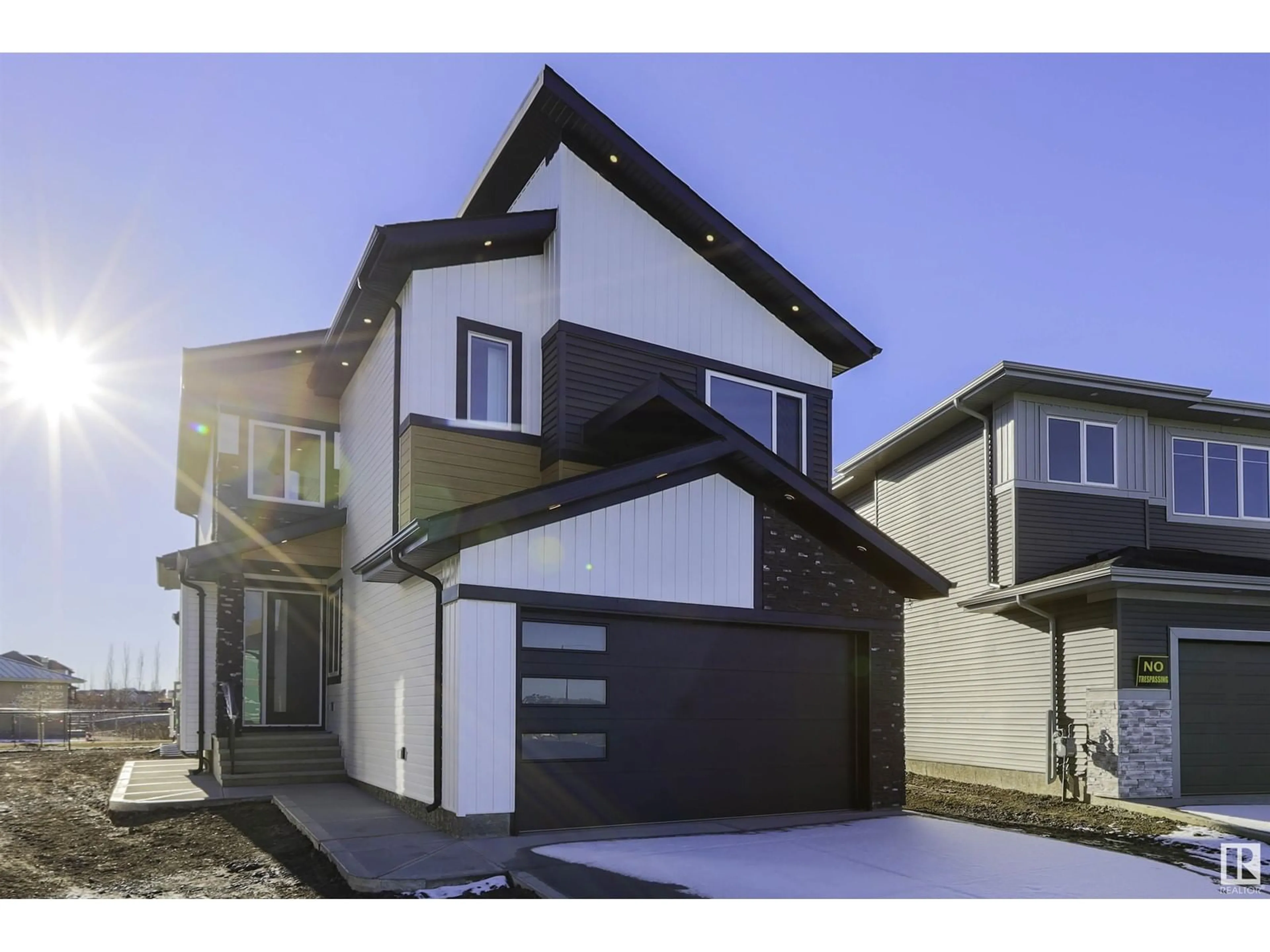 Frontside or backside of a home, the street view for 151 Creekside lane, Leduc Alberta T9E1T1