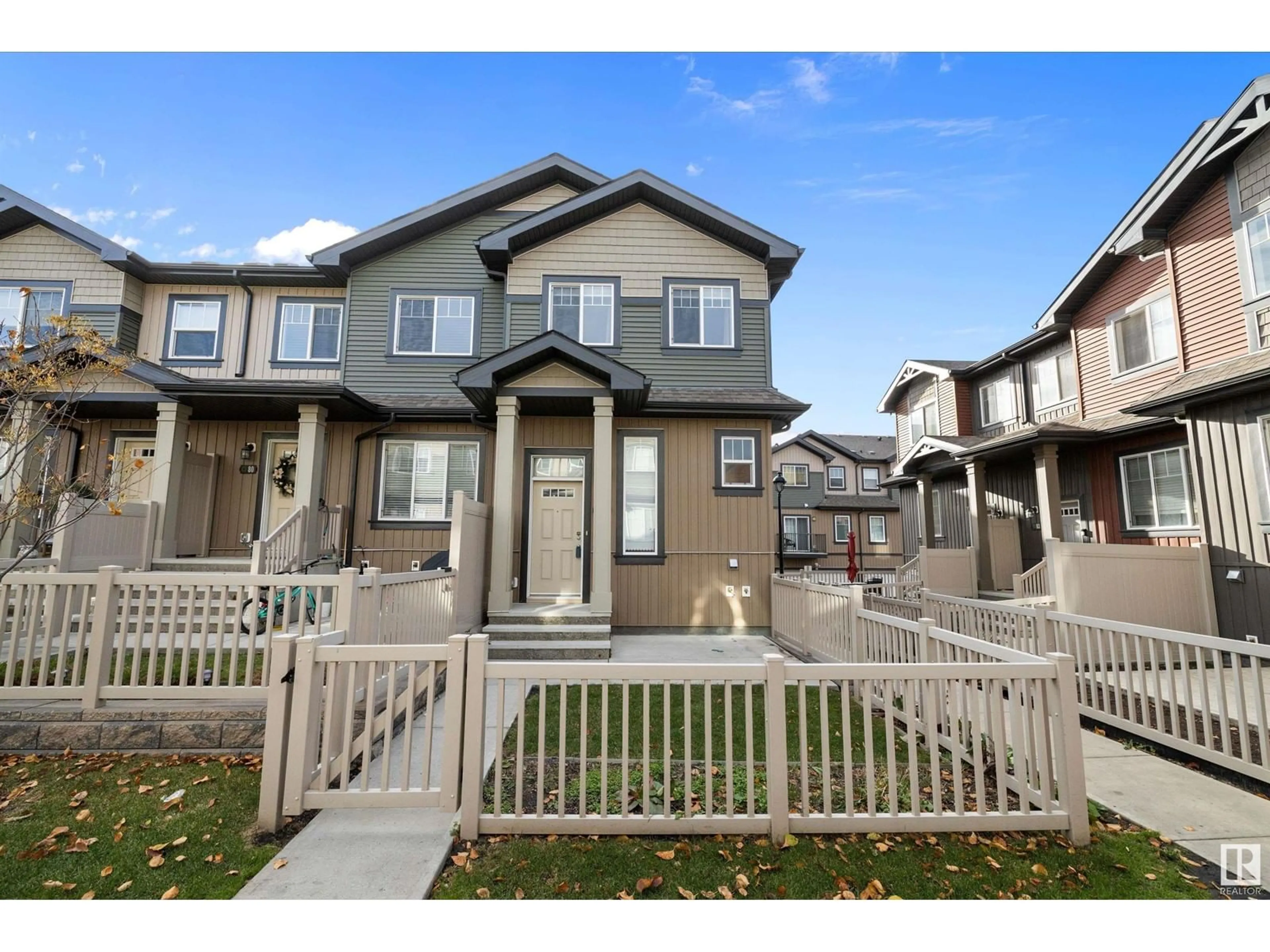 A pic from exterior of the house or condo, the fenced backyard for #81 3305 ORCHARDS LINK SW, Edmonton Alberta T6X2H1