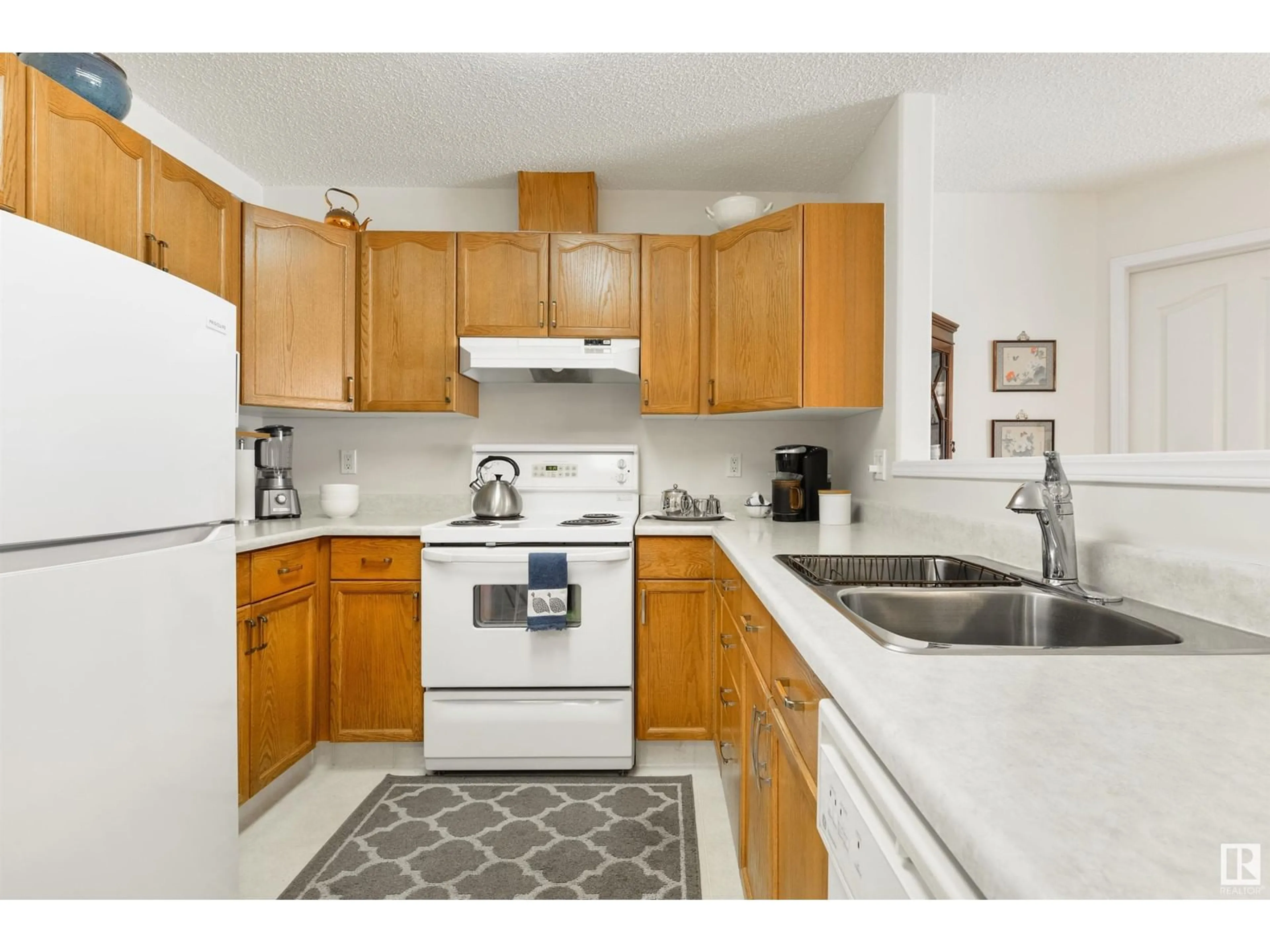 Standard kitchen, carpet floors, cottage for #402 182 HADDOW CL NW, Edmonton Alberta T6R2V1