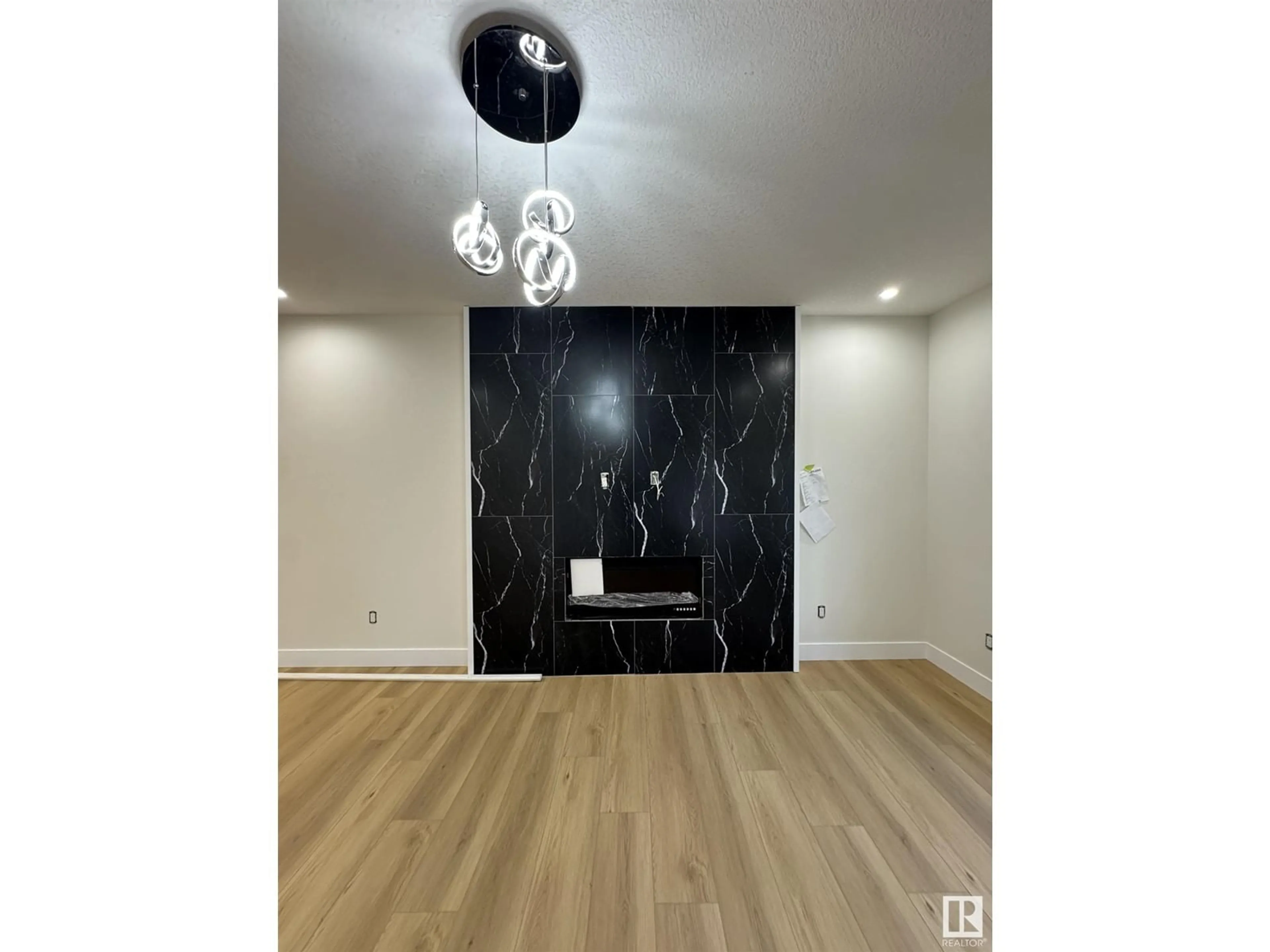 A pic of a room, wood floors for 9330 89 ST NW NW, Edmonton Alberta T6C3L2