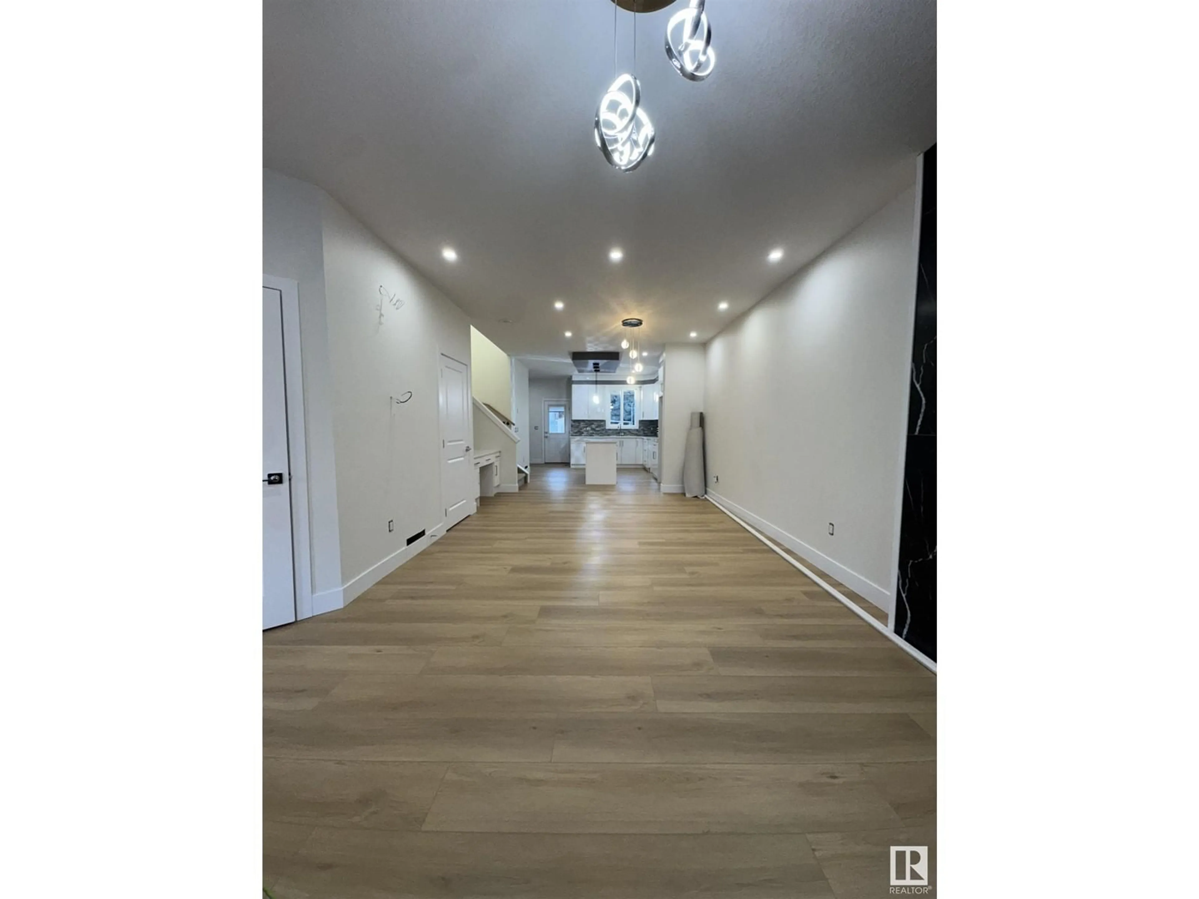 Indoor foyer, wood floors for 9330 89 ST NW, Edmonton Alberta T6C3L2