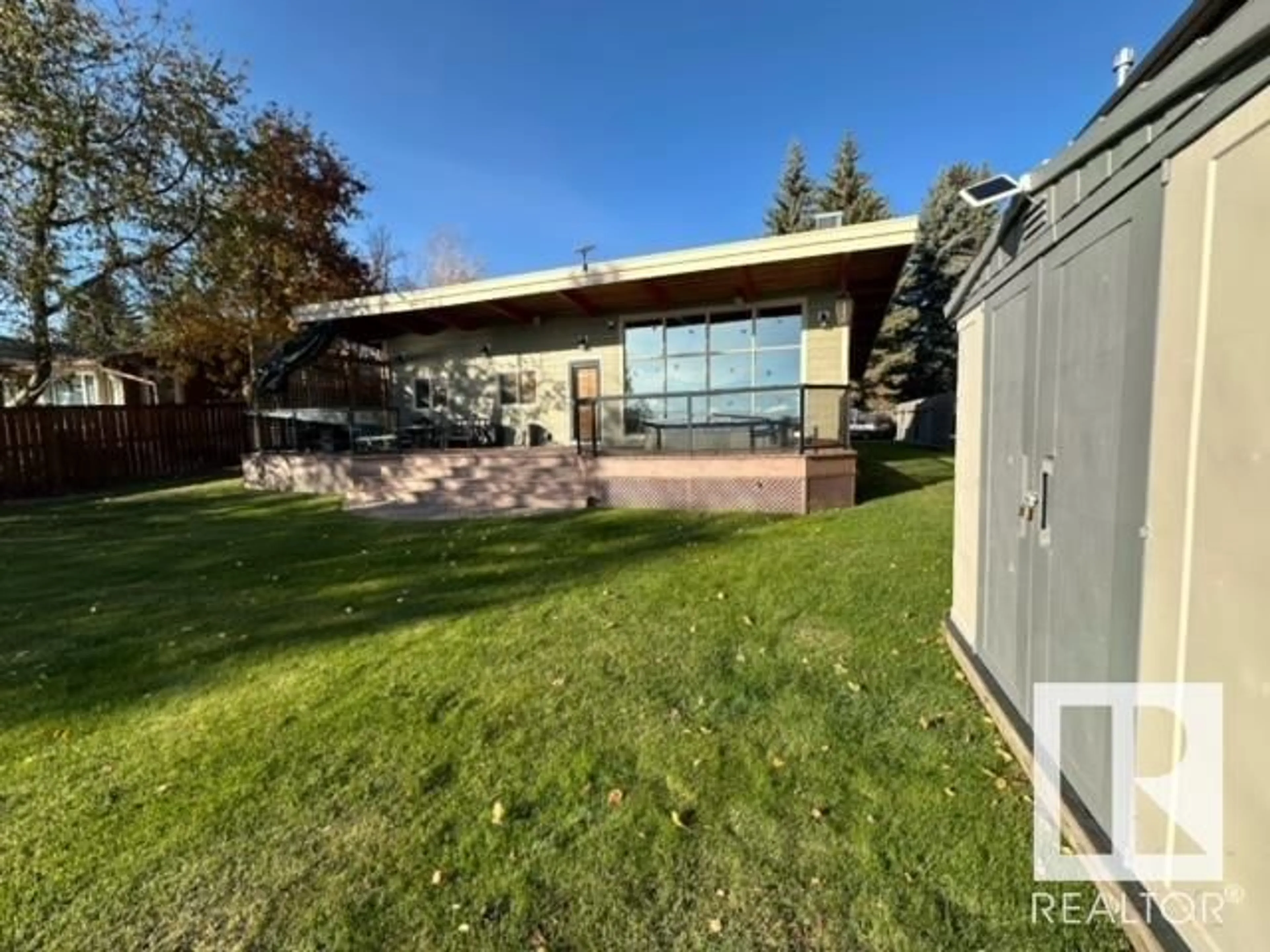 Frontside or backside of a home, the fenced backyard for 713 7 ST, Rural Lac Ste. Anne County Alberta T0E1A0