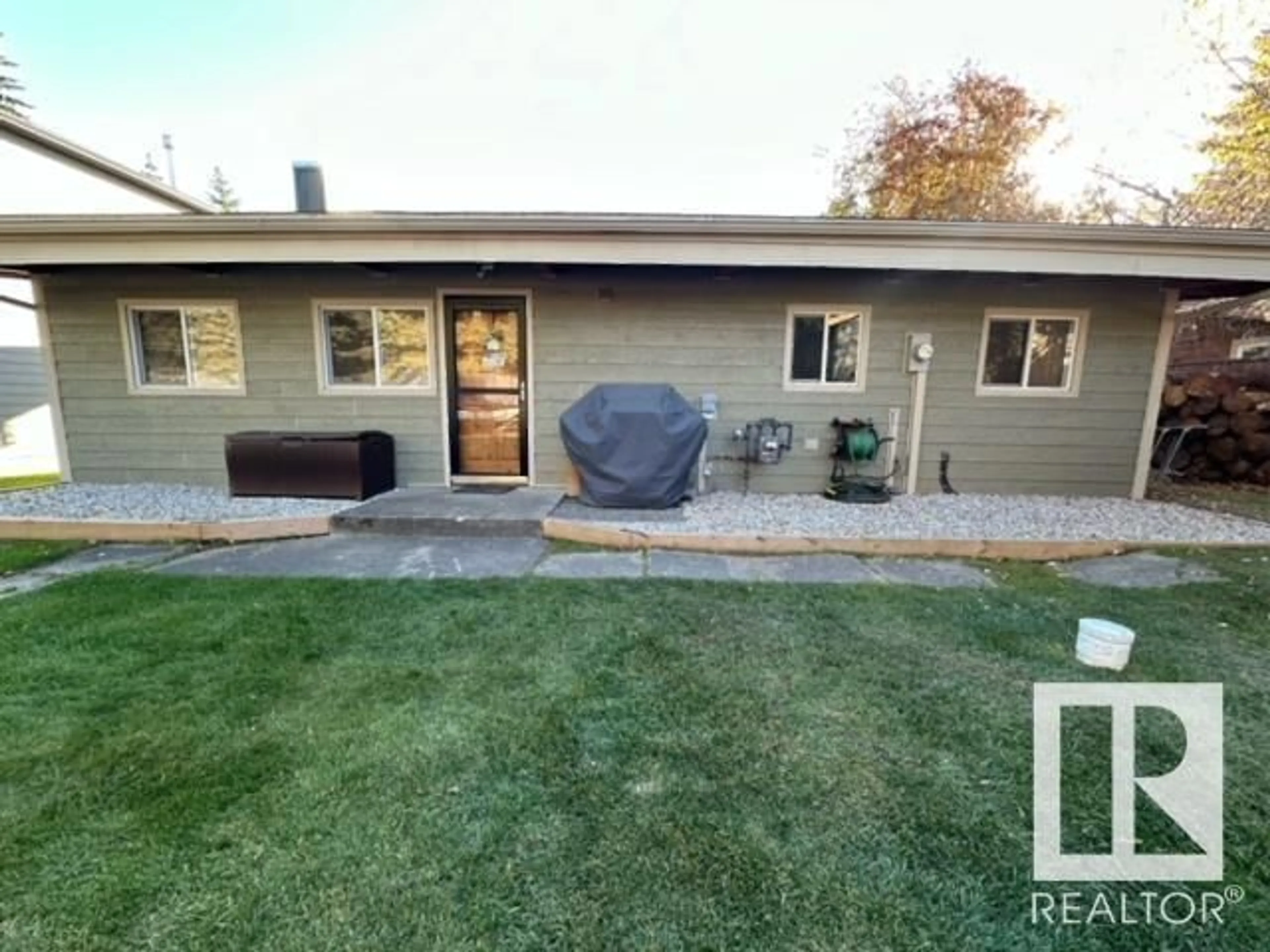 Frontside or backside of a home, the fenced backyard for 713 7 ST, Rural Lac Ste. Anne County Alberta T0E1A0