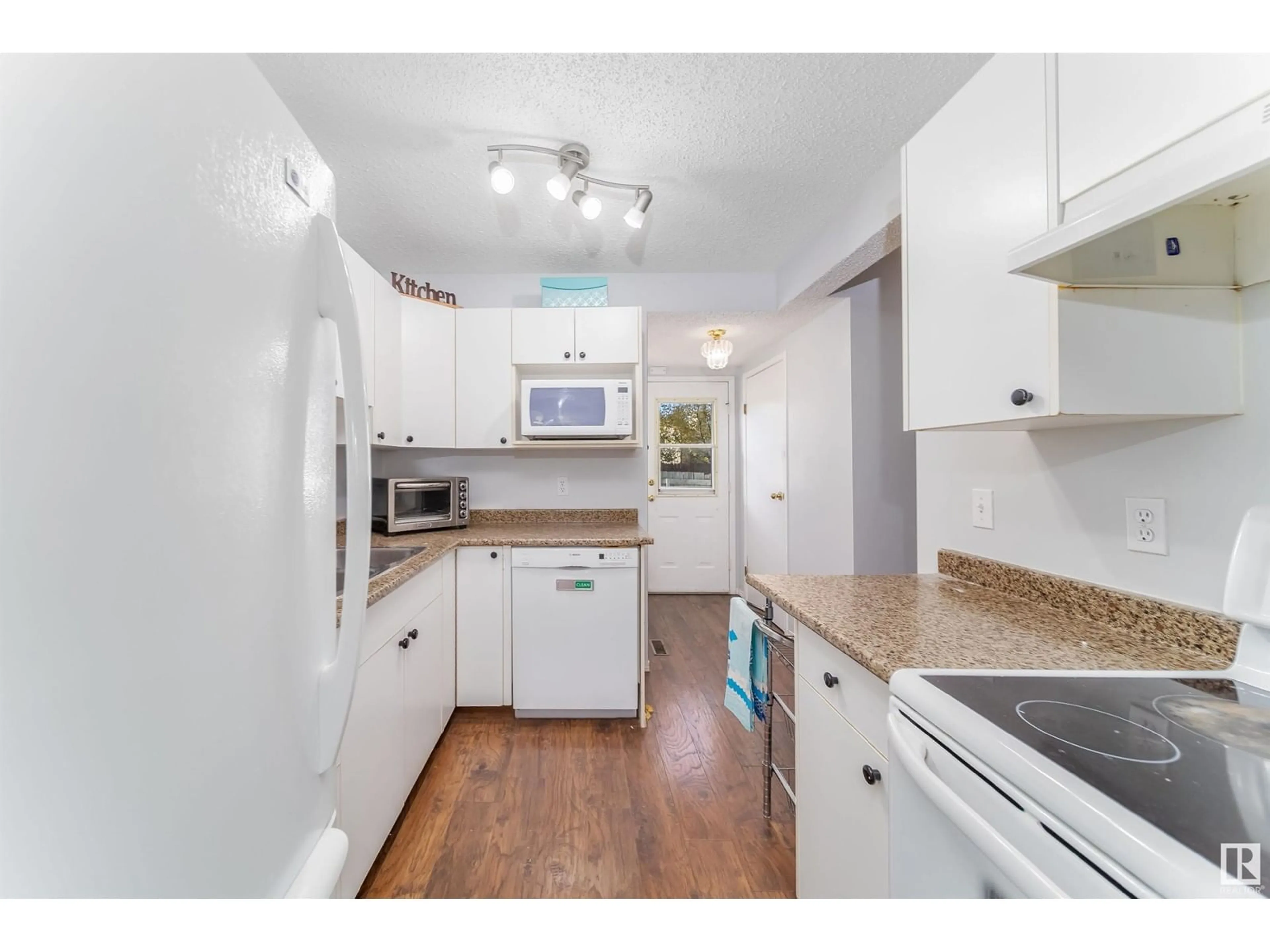 Standard kitchen, wood floors for 1540 MILLWOODS E NW, Edmonton Alberta T6L6V5