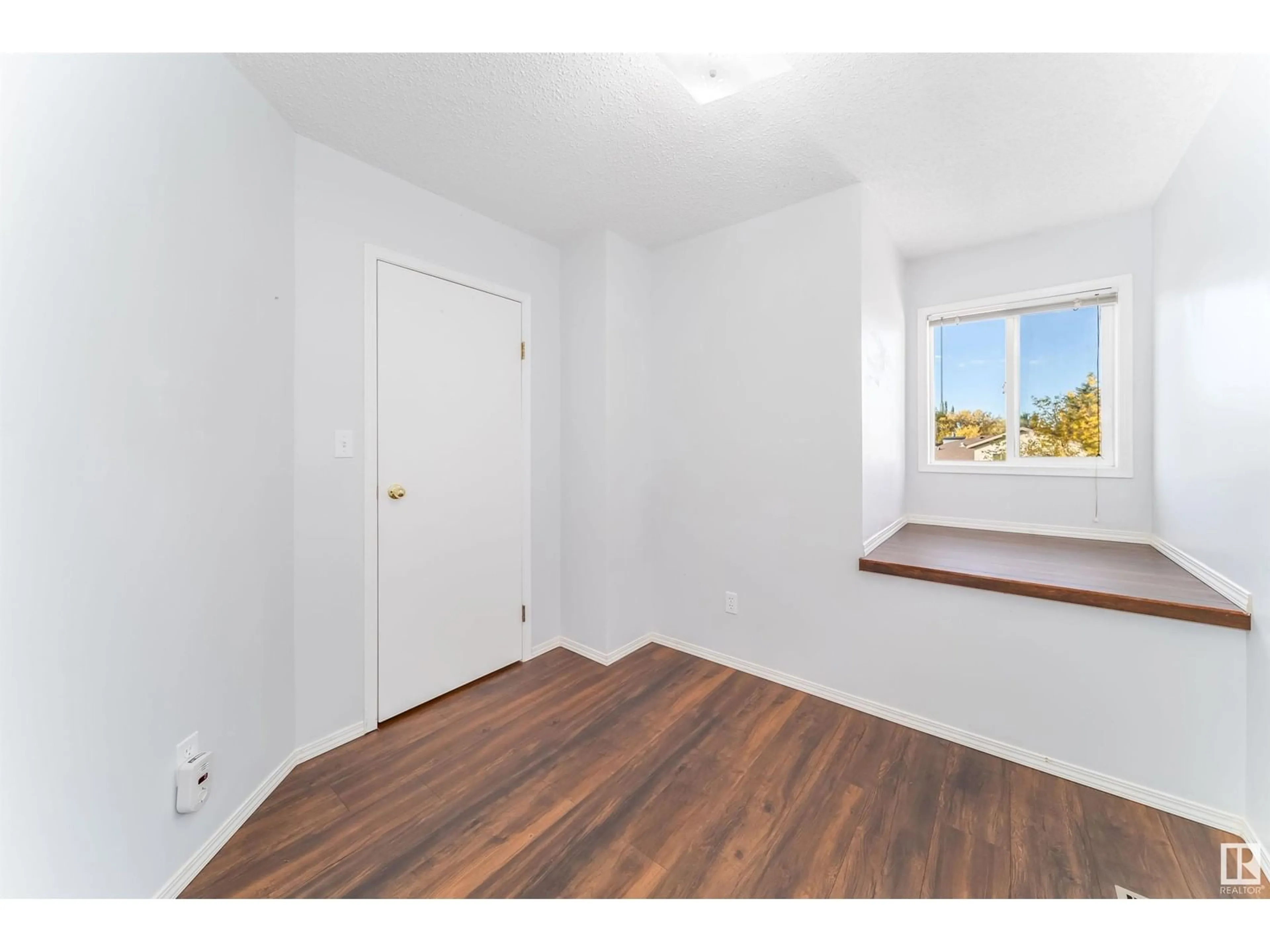 A pic of a room, wood floors for 1540 MILLWOODS E NW, Edmonton Alberta T6L6V5