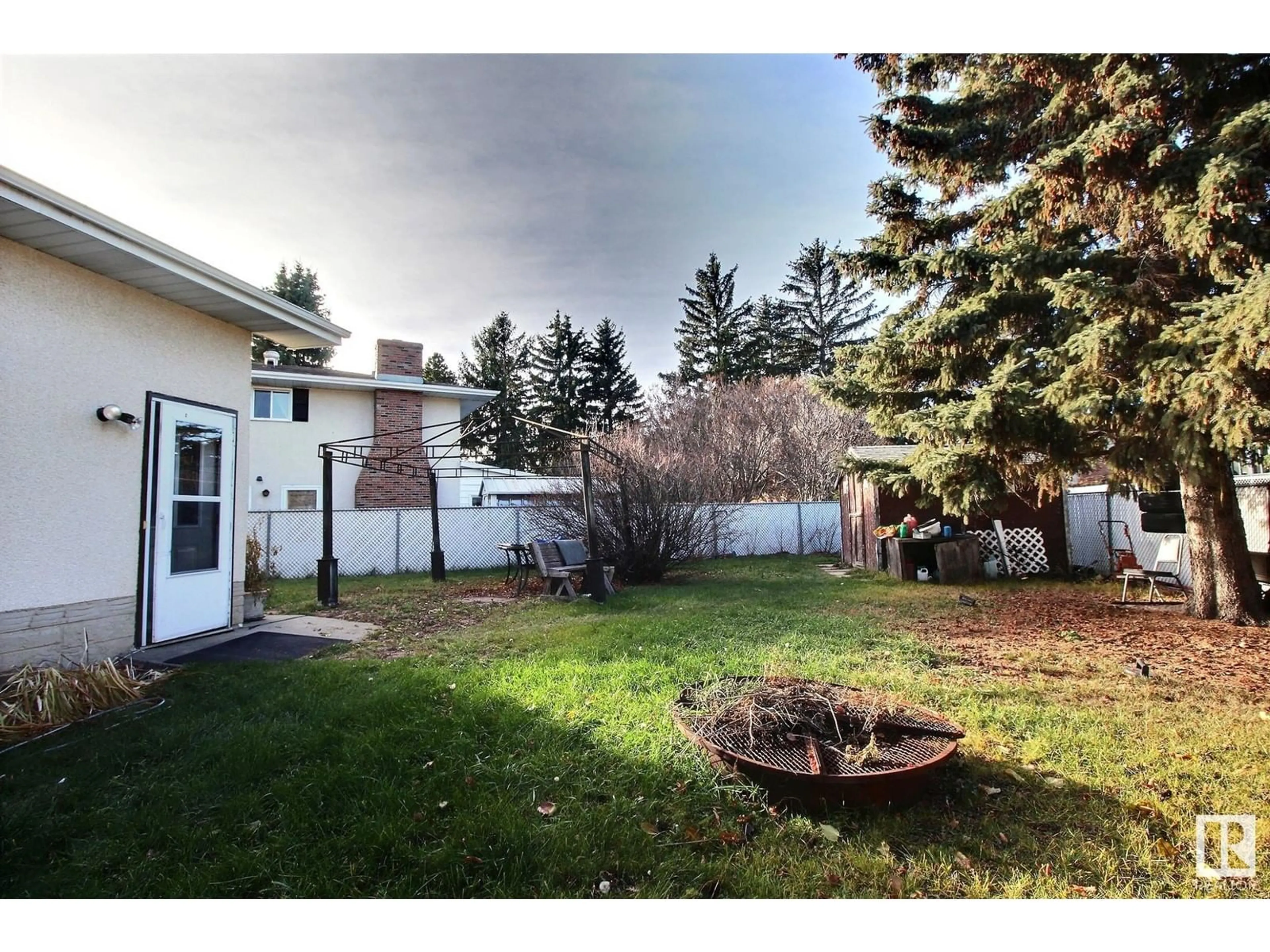 Frontside or backside of a home, the fenced backyard for 319 LEE RIDGE RD NW, Edmonton Alberta T6K0N5